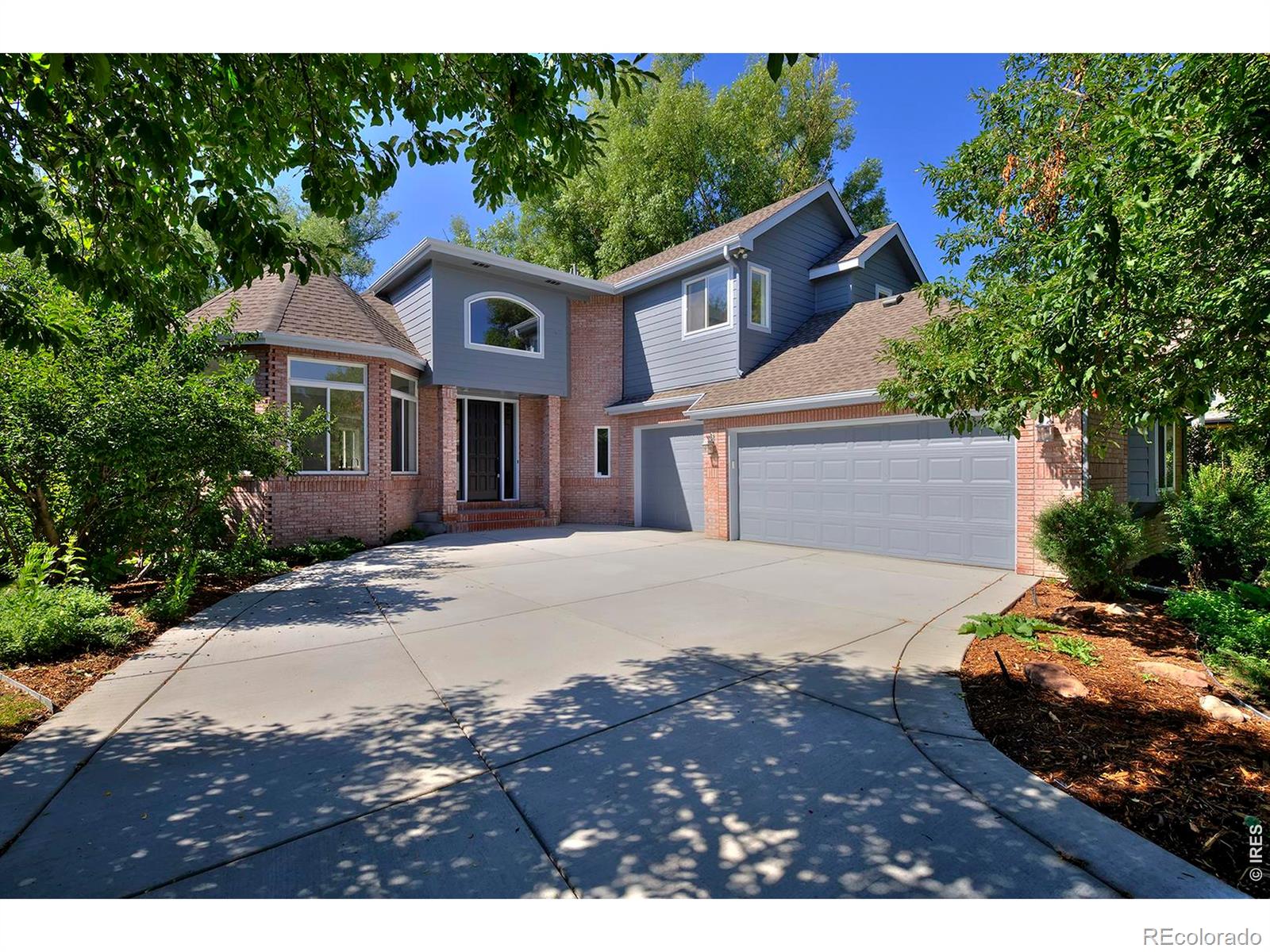 A true Boulder "unicorn" property, this luxury remodeled home backs to forested open space in an established, friendly neighborhood. Fresh, high-end finishes abound, and windows frame peaceful tree-filled views and fill the home with natural light from morning through evening. Your all-new kitchen is made for meaningful gatherings, with expansive quartz surfaces, an induction range, huge banks of custom Norwegian white oak cabinets, and peaceful views onto stands of swaying trees. Natural ash hardwood flooring, designer lighting and a neutral modern palette carry throughout the home. Entertain with ease in the open-concept living spaces or enjoy the expansive deck overlooking the fenced backyard and surrounding greenery-a dreamy setting for morning coffee or summer dinners. The primary suite was inspired by the owners' favorite designer hotels-a place to unwind beside your private fireplace, soak in the sculptural freestanding tub or spa-style shower, and enjoy the oversized, walk-in, custom closet. The flexible floor plan offers exceptional versatility with a main-level office or guest bedroom and full bath, three bedrooms upstairs including a Jack-and-Jill bath, plus an enormous walk-out lower level with two additional bedrooms, a bathroom, separate entrance and abundant living space that's ideal for guests or for lock-off unit potential. Set in one of North Boulder's most beloved neighborhoods, you'll enjoy miles of nearby trails and paths, a close-knit community close to the best of Boulder, fragrant spring-blooming plum trees, a three-car garage and the rare combination of luxury living with nature right outside your back door.