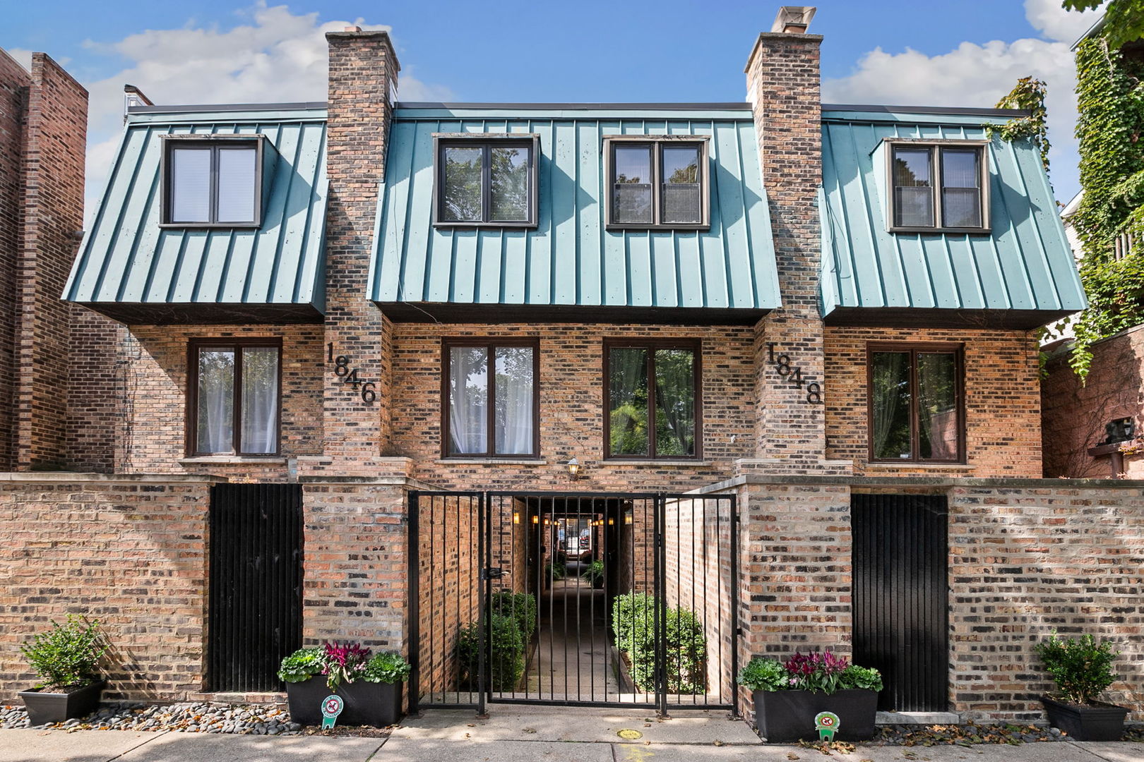 Step into this charming townhome, ideally located on a picturesque tree-lined street in the heart of Lincoln Park. The first floor offers a versatile office/den and a convenient half bath, with direct access to a private outdoor patio-perfect for grilling and entertaining. The second level boasts an open floor plan featuring exposed brick walls, wood ceiling beams, and a spacious kitchen with an island, granite countertops, and stainless steel appliances, all seamlessly connected to the living and dining areas. The third level includes two generously sized bedrooms and a full bathroom. Additional highlights include Lincoln Elementary & Lincoln Park High School district, in-unit washer and dryer, one outdoor parking space included in price, pet-friendly and low HOA  Unbeatable location: steps from the lakefront, Lincoln Park, Oz Park, Lincoln Park Zoo, Armitage and Old Town shopping and dining, and excellent public transportation. Don't miss this home on one of the best blocks in Chicago!