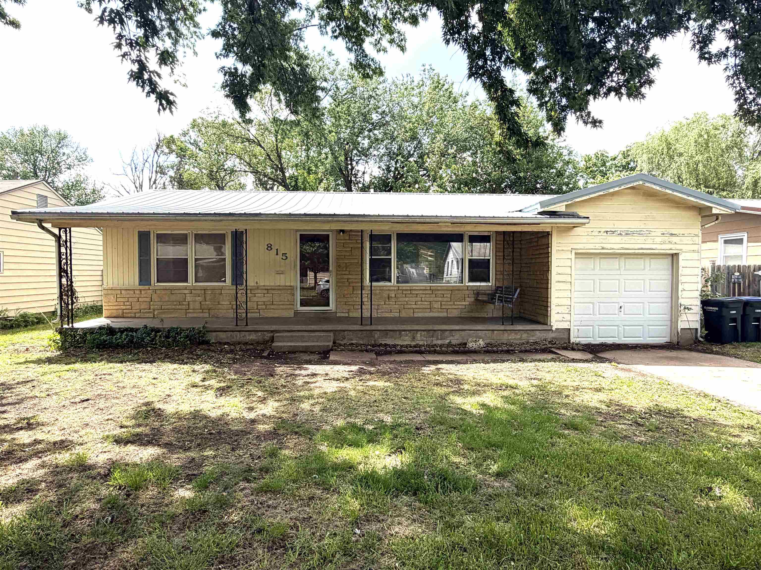 3-Bedroom 1-Bath 960 Sq Ft Home with Spacious Backyard!!! This home offers Original wood floors in the bedrooms, and some other practical improvements.  Which include a METAL ROOF, ELECTRIC PANEL, and SEWER LINE under house ALL LESS than 2 YEARS OLD!!!  Improvements offer peace of mind for new owner. The attached 1-car garage adds convenience, while the large fenced backyard is perfect for pets, play, or gardening. Enjoy outdoor living with a covered patio area and a storage shed for all your tools and hobbies.