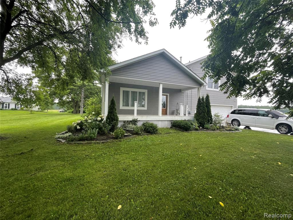Charming single family home nestled in a serene Belleville neighborhood. This residence offers an updated home with many features. Three bedrooms, two full bathrooms, plus a master with a private en-suite bathroom. Two car attached garage, plus large barn and an additional 2 car garage in the back. Some key features include upstairs laundry, walk-in closets, heated floors in the kitchen and dining area, brand new large deck in the back, balcony, jetted tub in master bathroom, tile and hardwood throughout, granite counters throughout, mud room, and much more. The expansive backyard provides ample space for outdoor activities and gardening. Barn has concrete poured in and is set up for heated floors. Extra garage with electric can be used for additional storage, or convert into a hangout! Conveniently located near local amenities, lots of great parks, and I-275. Lot next door is included, which might be able to split, build next door for yourself or for profit. Woods in the back have deer for those avid hunters. Lots of potential in a beautiful and quiet neighborhood with great neighbors! Sold “As Is”