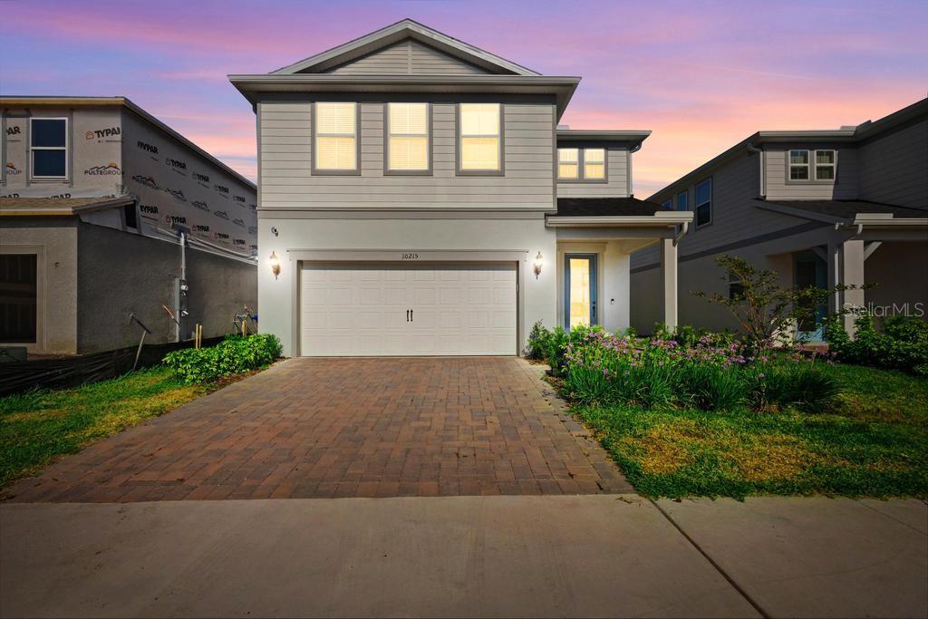 Take advantage of this rare opportunity to own a beautifully upgraded home below BUILDER PRICING & OWNER PURCHASE PRICE in a community where every other home for sale is over $1M! This motivated seller is relocating, which means incredible value for you.  This 2024 built home is thoughtfully designed with high-end finishes throughout. Enjoy the warmth and style of wood-look luxury vinyl flooring—durable, low-maintenance, and perfect for everyday living. The kitchen is a true showstopper with sleek Bianco Calacatta countertops, a modern backsplash, and upgraded sink, faucet, and lighting.  Additional upgrades include exterior soffit outlets for effortless holiday decorating—just one of the many thoughtful touches that make this home stand out.  This community is walking distance to O-Town West, Dr. Phillips Community Park, and highly ranked schools. This natural gas community is located less than two miles from I-4, theme parks and the famous dining, shopping and entertainment of Restaurant Row – all with a low HOA and no CDD.  Don’t miss your chance to own in this sought-after neighborhood. The refrigerator in the kitchen and the water softener in the garage do not covey with the sale of the property.  Call today to schedule your private tour!