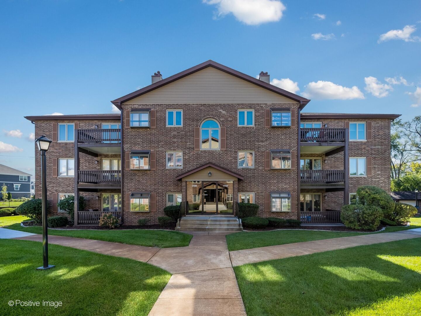Welcome home to this gorgeous condo in Tinley Park's premier RidgePointe Woods! This highly desirable, 100% owner occupied complex is perfectly located just a half mile from downtown Tinley and the Metra. This spacious home features an ideal open layout, oak hardwood floors throughout, is filled with natural light and showcases spectacular views of the beautifully manicured courtyard and gazebo from multiple windows as well as the oversized balcony. Eat-in kitchen with granite countertops, oak cabinetry, and room for a table overlooking the greenhouse window and courtyard. The expansive living room features a picture window and gas fireplace with newer tile/mantle and opens to the dining area which easily accommodates a table for 8. Double doors lead to the primary suite with a full wall of closets and private bath with a walk-in shower and loads of storage in the vanity. The 2nd bedroom also features a full wall of closets in addition to the original closet - so much storage space! - and access to the spacious 2nd full bath with penny tile, large vanity, and shower/tub combo. The unit also boasts a large walk-in laundry room with side by side washer & dryer, storage, and newer HVAC (2019). Large coat closet and intercom for guest entry. New bedroom windows in 2019. Private garage space conveniently located just outside the back door of the building with wall-to-wall shelves and new wifi garage door mechanicals. With 5 closets plus shelving in the garage, there is so much space for storage. Flexicore building for extra soundproofing between units. Top notch Tinley Park location just minutes from Downtown Tinley and shopping, dining, schools, parks, and Harmony Square. Super convenient access to expressways and Metra - ideal for commuters! With so much to offer, this fabulous home won't last long!