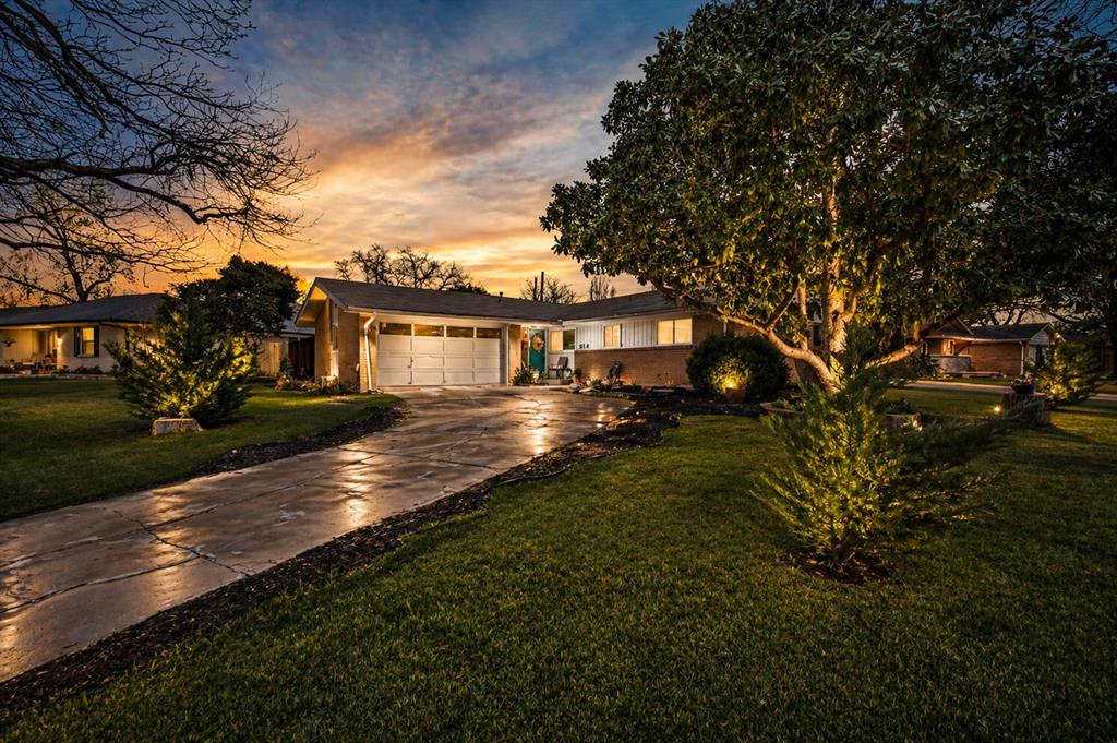 Modern updates. Timeless character. A location that keeps you connected.Welcome to this beautifully reimagined mid-century home in the heart of Richardson, perfectly positioned on an oversized lot with the space and flexibility today’s buyers want most. Offering 3 bedrooms, 2 bathrooms, and 1,341 square feet, this move-in ready residence blends clean design, thoughtful upgrades, and everyday comfort. The open-concept floor plan creates effortless flow between the living, dining, and kitchen spaces, making it ideal for quiet nights at home or entertaining guests.The kitchen delivers both style and function with granite countertops, crisp white cabinetry, stainless steel appliances, and a generous breakfast bar designed for gathering, dining, or your morning routine. More than $50,000 in recent improvements elevate the experience throughout the home, including updated flooring, fresh interior paint, modern lighting, and refined finishes that create a polished, cohesive feel. Both bathrooms have been refreshed with updated vanities and fixtures for a clean, contemporary look. Step outside and discover one of the property’s biggest advantages: an expansive backyard with room to entertain, garden, play, or create the outdoor retreat you’ve always wanted. Mature trees and established landscaping add warmth, privacy, and lasting curb appeal. Located minutes from major highways, shopping, dining, and UT Dallas, this home also offers access to highly regarded Richardson ISD. A better move in one of Richardson’s most established locations.