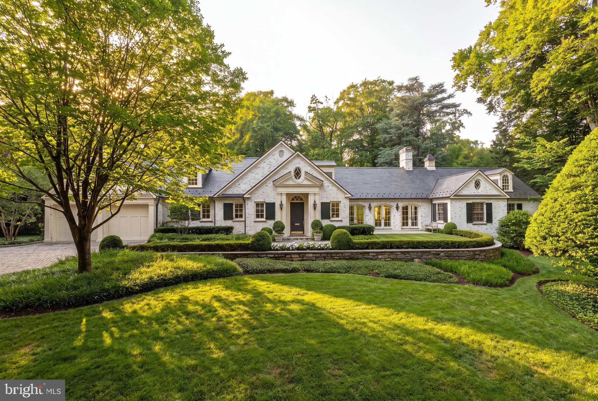 Prominently sited on 0.63 exceptionally level and private acres overlooking Indian Lane, Glenbrook Road, and Rockwood Parkway. Surrounded in all directions by 100' tall trees, the meticulously maintained manicured grounds were designed by Plusen Landscape Architects.  The original sprawling floorplan was completely reinvented in 2011 by Architect Marty Rosenblum of Philadelphia and Accent General Contracting with the late Bill Cochran. The stunning interiors are lined in French doors to countless outdoor living terraced areas and gardens. The Living Room off the gracious Entry Reception Hall with formal Powder Room has 16'+ceilings and is likely one of the best rooms in all of Washington. The far Western wing of the sprawling main level is a multi-room primary suite with large Bedroom open to a private patio, marble bathroom, dual dressing rooms, library, and a hidden office and half bath. The Eastern wing has a large gourmet Chef's kitchen open to a Family room with three light exposures, a banquet sized Dining Room, and a level mud room area + half Bath, and 2-car Garage. The wide, sweeping staircase in the Reception Hall leads to a gracious landing, 3 bedrooms, and 2 full bathrooms. A large storage and utility center is separately contained in the lower level under the Western wing for easy technician access. Whole house generator located on property.
