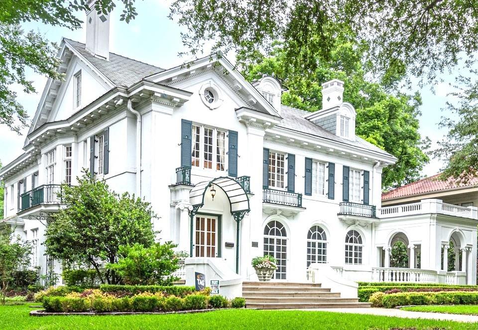 Prominently situated on a coveted corner lot along the prestigious Swiss Ave. A distinguished estate—1 of only 5 designated Dallas Historical Landmarks. Stands as a testament to early 20th-century grandeur & architectural brilliance. Designed in 1916 by renowned Hal Thomson, the residence marries the historic elegance that marked Mr. Thomson's attention to detail with contemporary luxury. The main house with a grand great room with Venetian plaster walls & sunroom over looking a secret garden. Elegant fml. dining rm has original chandeliers & sconces, 4 spacious bedrooms, 4 full baths, 2 half baths & library. Interior is adorned with soaring ceilings, oak hardwoods, dentate ceiling crown molding, handcrafted fireplaces & many steel casement windows letting in natural light, all culminating elegance & sophistication. Gourmet kitchen with 2 sinks, 2 dw, Wolf range with double ovens, microwave, warming drawer, quartzite counters, hidden sect desk, walk-in pantry, glass-front cabinets with lighting, ice maker, large & mini refrig & more. Primary suite is a private sanctuary. Bath features heated floors, luxury duo shower with rain & sauna features & heated tub. Sonos system serves many rooms & primary suite has separate sound for the shower. Huge media rm. equipped with mini fridge, microwave & theater equip. An elevator services the 1st & 2nd floor. Exterior is equally captivating with extensive landscaping, side Loggia patio, grand front walkway lit by tree-mounted spotlights, & a matching chicken coop providing fresh eggs daily. Backyard oasis has sparkling pool, hot tub, garden beds, lighting & an approx. 800-sq. ft. carriage guest house with the 1916 telephone & additional space not in the main sq. ft. Dog shower in mudroom & outdoor shower are adjacent to the pool area. This exceptional estate embodies the perfect blend of historical significance and modern comfort, offering a rare opportunity to own a piece of Dallas's rich architectural heritage!