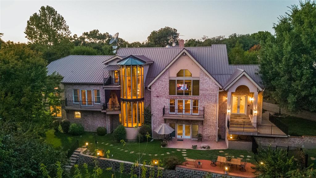 Step into your slice of Texas Hill Country in the heart of Lakewood, one Dallas’ most prestigious neighborhoods. Home also being sold as a building lot.  An incredibly private setting with 1.290 acres,  56,190 SF per plat. This creekside property is hidden behind rolling lawns and mature trees, creating a private oasis in the middle of Dallas. Built to last a lifetime by the owner, a commercial builder, high-quality construction is evident throughout.  Oversized bedrooms including an enormous primary suite with two full baths.The lower level has over 2000 SF of flexible space perfect for a media room, studio, office, or space for a fourth bedroom and bath. Walking distance to Lakewood Elementary & White Rock Lake, this property includes two dwellings, the 6,570 SF main house & an 800 SF, one bedroom, guest house. Additional features: Beautiful library, cathedral ceilings, temp-controlled 4-car garage, backup generator, tankless water heater. Pool renderings & guest house photos available.