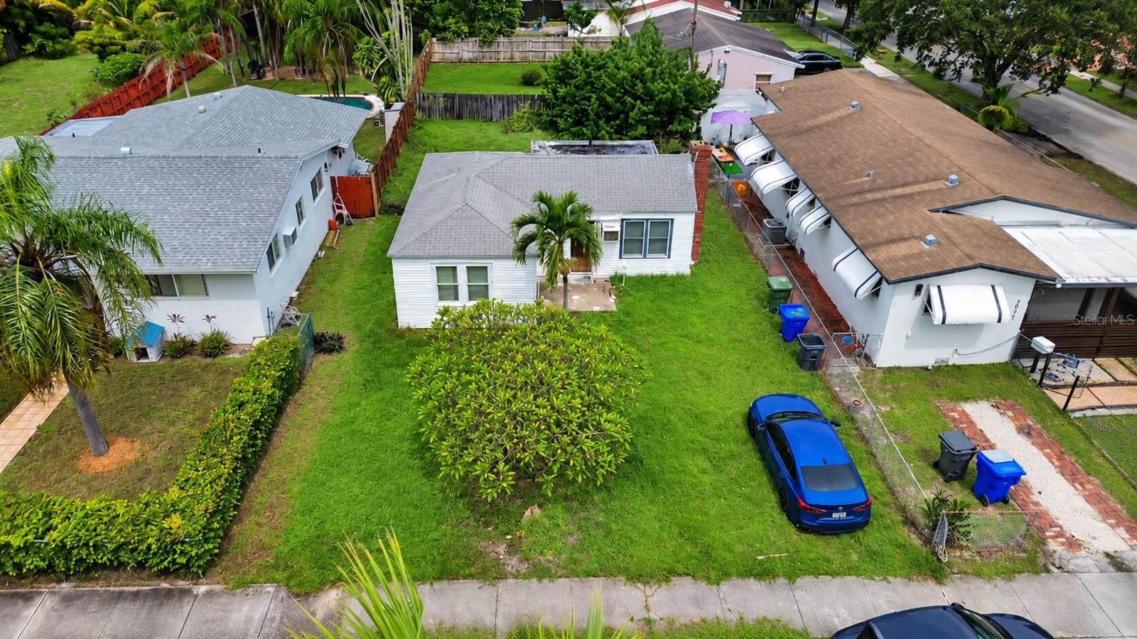 INCREDIBLE INVESTMENT OPPORTUNITY IN HOLLYWOOD!!! This 2-bedroom, 1-bathroom single-family home sits on a SPACIOUS LOT with NO HOA and is ready for its next transformation! With a large front and backyard, mature tropical landscaping, and plenty of room to reimagine the property, this home offers tremendous potential for a FIX-AND-FLIP, LONG-TERM RENTAL, NEW BUILD, or owner-occupant renovation.                                                                                                                                                                                    Step inside to a SPACIOUS LIVING AREA featuring the home’s original BRICK FIREPLACE & CHIMNEY, providing plenty of character and a great focal point for a future redesign. With multiple windows bringing in natural light and an open footprint, the space offers a blank canvas to modernize and make your own.                                                                                                                                              Through the doorway to the right is the KITCHEN AREA, already taken down to the studs and ready for a complete transformation. The opened walls and ceiling give investors a head start and the freedom to REIMAGINE THE SPACE FROM THE GROUND UP. Continuing through the home are TWO BEDROOMS, including one that has been partially opened up for renovation, along with a FULL BATHROOM featuring a tub/shower combination, vanity, toilet, and window—all ready to be updated and redesigned.                                                       Additional features include an approximately 14-YEAR-OLD ROOF, PVC & COPPER PLUMBING, a SEPTIC TANK located in the backyard, and a NEW WATER HEATER that will convey with the property. Whether your vision is to RENOVATE AND RESTORE the existing home or TEAR IT DOWN AND START FRESH, this property offers the flexibility and potential to create something entirely new. With a SPACIOUS LOT, NO HOA, and convenient Hollywood location near shopping, dining, major roadways, beaches, and Fort Lauderdale-Hollywood International Airport, bring your contractor, your plans, and your creativity—THE POSSIBILITIES ARE WIDE OPEN!