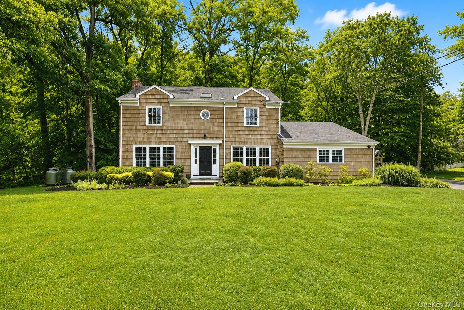 Located on one of Bedford's most desirable streets, this classic four-bedroom, two-and-a-half-bath Colonial offers the perfect combination of charm, comfort, and convenience. Set on a level, private one-acre property in a quiet neighborhood, this home is designed for both everyday living and memorable gatherings. The annual Halloween block party is a special event for residents.The spacious interior features hardwood floors, two fireplaces, and a thoughtful floor plan filled with natural light. Generous living and entertaining spaces flow effortlessly to the private backyard, where the expansive lawn offers plenty of room for recreation, gardening, or relaxing in a peaceful setting. Additional 800 square feet finished in LL with cedar closet.Ideally located just minutes from local schools, the Bedford Village Green, and Bedford Village Memorial Park, this home provides easy access to the heart of the community while offering the privacy and serenity that make Bedford so special.Additional features include a whole-house standby generator, installed in 2014, providing comfort and peace of mind throughout the seasons. A wonderful opportunity to enjoy classic Colonial living in one of Bedford's most sought-after locations. Note the low taxes.