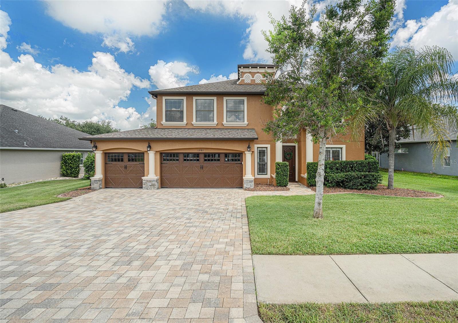 Stunning Five Bedroom-Four bathroom home in the Pristine Place Subdivision of Spring Hill, with over 4,000 square feet of perfect living space. It's all about the details for this home...crown and base moldings, high ceilings, decorative ceiling fans, Quartz Countertops, Gourmet Kitchen with updated stainless steel appliances surround by wood cabinetry, which is the centerpiece of an open floor plan that flows comfortably into family room, with french doors that leads out to the lania & salt water pool area in superb condition!  The kitchen & family room ends into the primary bedroom featuring a large walk-in closet, spacious modern bathroom with quartz counters and ceramic tile flooring and walls. All of that is just downstairs, upstairs there are four very large bedrooms with ceiling fans and large closets.  One of the upstairs bedrooms has an en-suite bath giving this home two master bedrooms!  Pristine Place has low HOA with amenities such as Clubhouse, Community Pool, Gated Community, and more. New Hardwood flooring throughout this home gives it a regal one of a kind home. This home was built with love using nothing but the best and highest quality flooring, light fixtures, and overall design.  The price is a bargain for the quality this home offers and future value. Topping it all off is a 3 car garage!  This home is a MUST see and purchase!
