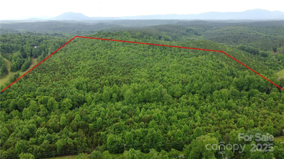 Rare opportunity to own one of the nicest Parcel of land, 10 minutes from Rutherfordton and 25 Minutes to Lake Lure! This property has it all, Gently Sloping Topography for easy development, 2,697' of County Road frontage, Maple Creek running through smaller side of property, Power access borders property lines on both sides of property. 10 Minutes from Rutherford Regional Medical Center, 3 Minutes to Piedmont Gun Club. This property gives you all the luxuries of living close to town, while still feeling like you live deep in the mountains! A truly one of a kind opportunity.