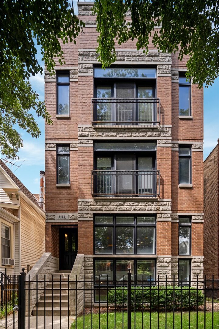 Discover a seamless blend of luxury and urban sophistication at 3422 North Bosworth Avenue, Unit 1, Chicago in Lake View. This exquisite duplex down offers the essence of a single-family home with the charm and convenience of modern living. Spread across 3,200 square feet, this residence is adorned with high-end finishes and thoughtful updates throughout. The heart of the home is the elegant kitchen, boasting state-of-the-art appliances and a functional layout that inspires culinary creativity. Enjoy the ambiance of two cozy gas fireplaces that warmly invite you to relax and unwind. The primary suite is an ultimate retreat, complete with a newly updated bath featuring a luxurious steam shower and soaking tub. Each of the four bedrooms offers generous space and comfort, complemented by ample storage, including a walk-in closet and additional pantry space. Don't miss the second en-suite bedroom conveniently located on the lower floor, perfect for guests and family to retreat to for added comfort and privacy. Indulge in outdoor serenity with a private deck off your primary suite. The full basement family room with its impressive high ceilings and ample natural light offers endless possibilities, while modern amenities like a built-in bar, central AC, and smart security system elevate your living experience. This pet-friendly abode includes a garage parking space with electric charging and designated storage, ensuring convenience at every turn. With an array of luxurious features and a prime location six minutes walk from the Southport Corridor, this home is designed to enrich your lifestyle with elegance and ease. Welcome to a world where every detail is crafted for comfort and style!