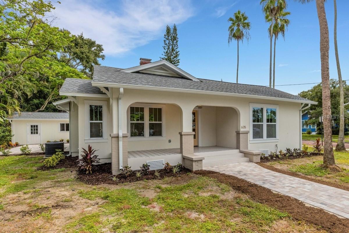 Virtually Staged. Very seldom does a home like this come along! This unique, historic Dunedin property combines the charm and nostalgia of a century ago with all the 21st century amenities of today. It sits in the heart of downtown on a corner lot in a golf cart friendly neighborhood. It is also high & dry in a NON-flood zone. Home offers a bright, efficient, split bedroom plan with an abundance of indoor and outdoor living spaces. It has been thoughtfully redesigned and totally rehabbed to create a beautiful masterpiece one can appreciate. It features an attractive curb appeal with welcoming front porch, two patios, an oversized garage and a large, paved parking pad. Countless windows allow natural light to adorn every room. Hardwood & tile flooring with 8" baseboards frame and define the rooms. Custom window & door moldings capture the time period and enhance the home's interior. French doors, glass doorknobs, 2-panel doors, and a wood burning brick fireplace preserve the home's history. A gourmet kitchen, along with new appliances - bathrooms - light fixtures - ceiling fans - recessed lights - transom windows and cosmetic upgrades incorporate modern elements to make this home truly special. New electrical - plumbing - impact windows - shingle roof - pavers - sprinkler system and detached garage complete this exceptional property. Best of all, it is located in Historic Downtown Dunedin with its unique shops, top rated restaurants and countless activities. It's just a short drive from several shopping hubs, the Dunedin Causeway, Honeymoon Island, Westfield Mall, Quaint Ozona, Eclectic Safety Harbor, Award Winning Clearwater Beach, and the famous Sponge Docks of Tarpon Springs. Ride your bike on the Pinellas Trail, take a stroll on the Causeway or watch a waterfront sunset over the Marina, there's plenty to do in Dunedin! Other amenities include: beaches, parks, casual & fine dining, roof top bars, micro-breweries, cafes, bike riding, boating, fishing, downtown festivals, concerts, art shows, spring training baseball, championship golf, sunsets, and events at the Community & Fine Art Centers. This is a MUST SEE for buyers seeking a charming, move-in ready, historic home with an active and vibrant lifestyle this property conveys.