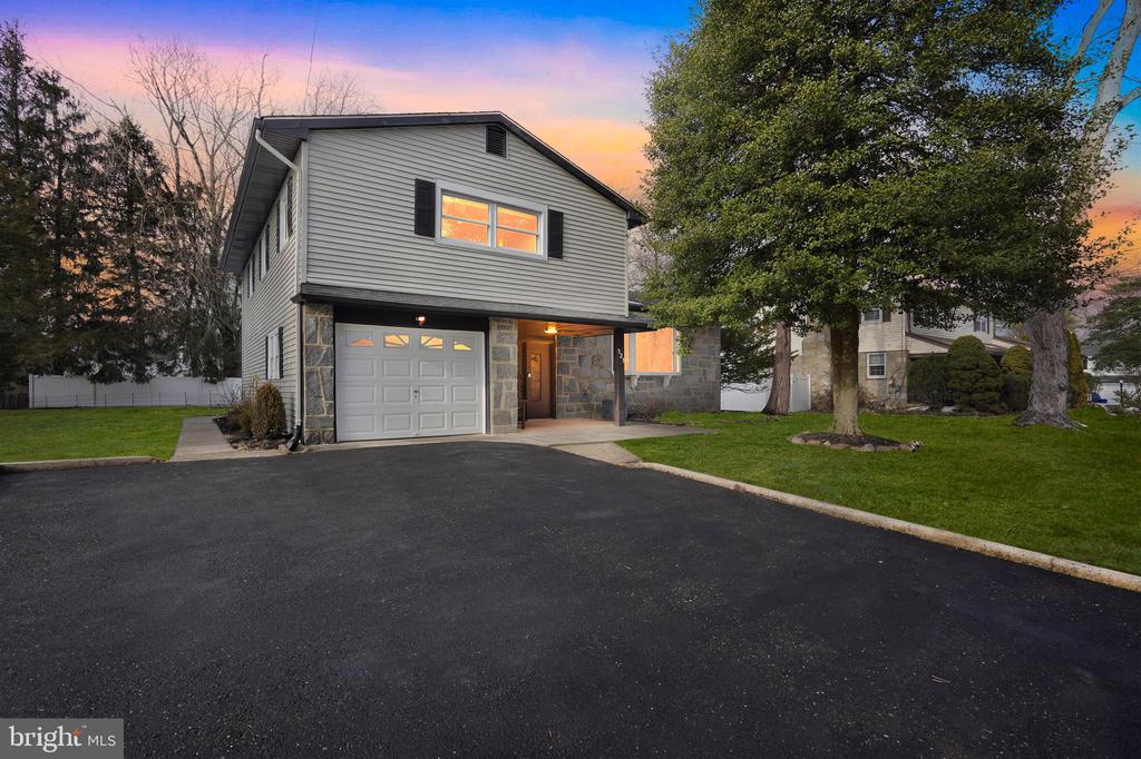 This one is a dream home that checks all the boxes and then some! 323 Parry Road is a beautiful, move-in ready split-level offering an ideal blend of style, comfort, and functionality; it has everything you need to truly enjoy where you live. Designed with understated luxury in mind, this extensively updated residence in the highly desired Chadwick development, showcases quality craftsmanship and thoughtful improvements throughout. From the moment you enter, you’ll notice the inviting layout, fresh paint, and attractive flooring that create a warm, welcoming feel. The entry level includes a foyer, coat closet, laundry area, powder room, and a large versatile bonus room with sliding doors leading to the backyard; perfect for entertaining, a home office, recreation, or hobbies. A finished basement adds additional flexibility along with ample storage. Upstairs, a bright living area with a large bay window flows seamlessly into the dining space and updated kitchen, featuring modern finishes, abundant cabinetry, generous counter space, and an island suited for everyday use or gatherings. Custom built-in shelving along the staircase provides both architectural interest and practical organization. The upper level offers a full hall bath, three comfortable bedrooms, and a fourth room converted into a spacious walk-in closet. The primary suite includes a private ensuite bath with double sinks and a relaxing spa-like, jetted tub complete with TV screen for real retreat experience. Outdoor living is enhanced by a recently constructed deck, patio, and porch overlooking the expansive yard. Major upgrades include newer windows, a newer roof, updated bathrooms with heated mirrors, and newer sliding doors. Additional highlights include central air, forced-air heating, public water and sewer, and a one-car garage with brand-new epoxy flooring plus driveway parking. Conveniently located near major roadways, shopping, dining, and schools, this well-appointed property offers comfort, convenience, and lasting value. Showings begin at the Open House on Saturday, 2/21, from 1–3 PM.