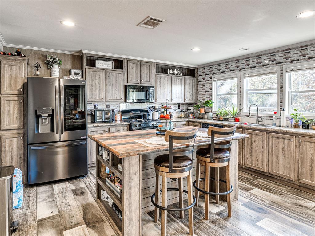 Charming Country Retreat Near Lake Thunderbird.
Escape to your private oasis with this beautifully designed home nestled on 2.2 peaceful acres.  This spacious 3 bed/ 2 bath features an open floor plan designed for comfort and entertaining.  The large kitchen is a dream and features an oversized island, gas stove, tons of storage and counter space, wet bar, and did I mention the LG Instaview refrigerator stays! The spacious master suite is privately located on one side of the home with a huge master bath, walk in shower,  jetted tub and built in vanity.  On the opposite side of the house, you'll find a full size bath and two additional bedrooms, one of which is accessible to the bathroom.  
Walk outside and relax on your large covered patio or watch the family play in the above ground pool.  Property also features a 20x30 shop with electric as well as a she-shed with power and a window unit.  Home inside and out is wheelchair accessible!  Cox Fiber has been brought out for internet.  Property also has RV pad and power hookups
Tucked just off the beaten path this one offers the perfect balance of seclusion and accessibility.  Come see why this one feels like home!