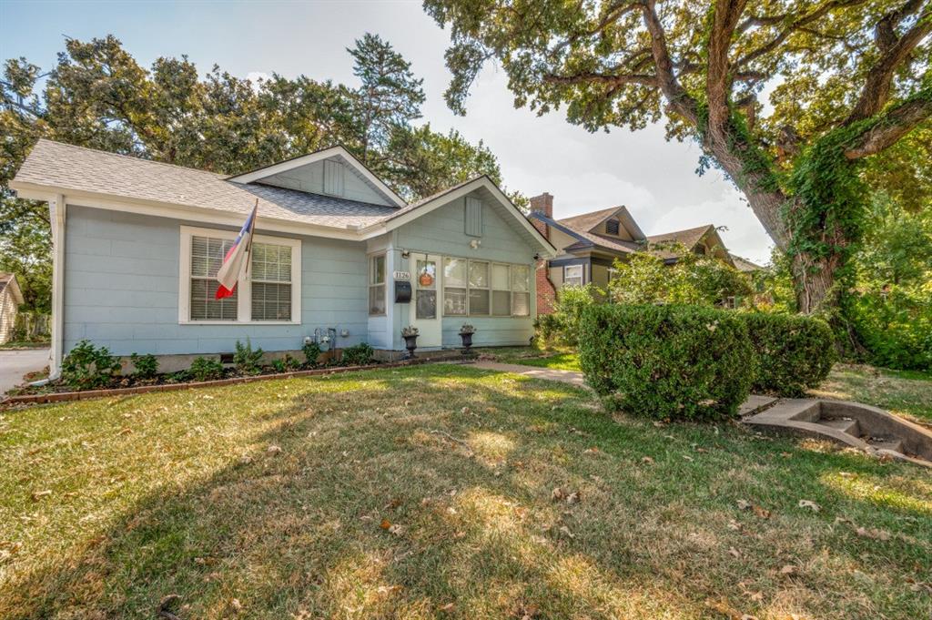 Charming 1930's home, with major upgrades to electrical, plumbing, HVAC, Hail resistant class 3 Roof (with warranty's). Step into the sunroom with fully screened in windows and warmth to welcome you into  the  Living room with the gas brick fireplace, Fully Remodeled Kitchen, Bathroom and LVT luxury laminate plank flooring ash colored throughout interior. The house has decorative lighting, build ins in primary bedroom and Hallway that showcase the homes vintage appeal.  Large wide windows in living room and dining room and bedrooms.  The kitchen features granite countertops and soft close cabinets, a breakfast bar that separates dining room form kitchen area  gas stainless stove, tankless water heater , large dining room and an eat in kitchen make this home perfect for entertaining.  Big bedrooms, a bathroom with a soaker tub and build in cabinets. Ceiling fans in all major rooms.The oversized yard has so many possibilities for entertaining or adding that outdoor kitchen, she shed and still have lots of room for roaming around.  The backyard also  has a 10x7 sun cast modernist sliding door storage shed made of heavy metal enforced plastic from Costco.  so much room for all your yard and outdoor fun.