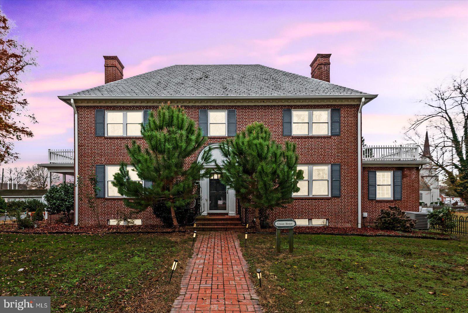 Welcome to the Chinn House in Tappahannock! Gorgeous brick colonial with views of the Rappahannock River. This home was built in 1950 and the original craftsmanship and character still remains in this home.Enter the foyer and you will see the arched doorways and the stunning peg flooring!! The main level offers a living room with water views , crown molding, a well crafted fireplace and mantle. This leads into the formal dining room with built in corner cupboards, more crown molding and access to the huge length of home screened porch. The galley kitchen offers ease of access to pantry, garage, screened porch along with having updated fixtures it has great views over the back yard.The main level offers a huge office with water views and a full wall of built in shelves and cabinets. The room was used as the office/library but could be used as a bedroom. The full bath is just outside of this room. Head upstairs to the primary suite. Full of windows, wood floors and great views this space won't disappoint This room has built in dressers to keep that original aesthetic.There is a smaller bedroom (was used as walk in closet) along with a front facing bedroom and a rear facing bedroom that has access to the covered garage balcony. Another full bath is on this level as well. This home has a basement with plenty of storage, the laundry area and a separate room with a fireplace. Sitting on a corner lot, the exterior offers mature plantings, large front and rear yards,  a fenced rear yard, producing garden, garage with a covered balcony and interior access.Centered in the heart of the town - you can enjoy all Tappahannock has to offer. Public access locations and water activities all around. Floor plan in pictures!