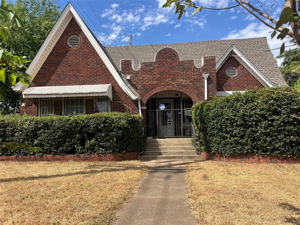 Step into the character and spaciousness of a true 1931 Crestwood bungalow! This distinctive 3 bed 1.5 bath home offers an impressive 2,165 sqft, blending vintage charm with the space and flexibility today's buyers crave. Inside, you will find a stunning living area with original tiled fireplace, spacious bedrooms, abundant storage and a basement with  utility space. This corner lot provides additional outdoor space and parking. The detached 2 car garage also offers a bonus room with air conditioning that could be used a a studio, home office or additional living space.  Located in the established Crestwood Addition, this is a rare opportunity to own a substantial historic-era home with character and plenty of possibilities. Home is being sold "AS IS".