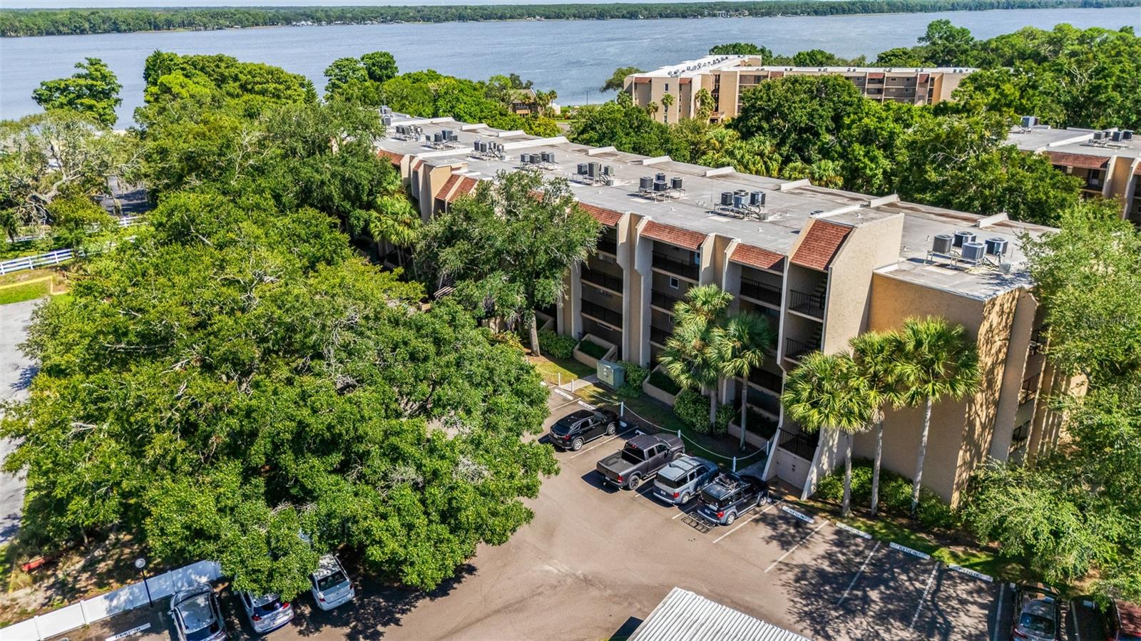 Lake Tarpon Sail & Tennis Club, offering peaceful lake views and a comfortable, private setting. This move-in-ready unit has been freshly painted and features updated flooring and light fixtures throughout. Both bathrooms were remodeled a year ago, adding a fresh and modern feel.The spacious primary suite offers excellent storage, including a large mirrored wardrobe that will remain with the unit, providing valuable additional closet space. The guest bedroom offers an added level of privacy, with no window facing the interior hallway; instead, it features access to its own private balcony, creating a quiet and inviting retreat.Enjoy resort-style amenities including a heated pool, tennis courts, marina, BBQ area, and a newly renovated clubhouse featuring a fitness center, library, and party room. The community provides plenty of opportunities to relax, stay active, and enjoy the Florida lifestyle.Parking options include open parking and designated visitor parking. Covered Carport space may be available.Ideally located near historic Downtown Tarpon Springs, with its charming shops, restaurants, entertainment, and famous Sponge Docks just minutes away.Beautiful lake views, thoughtful updates, excellent amenities, and a convenient Tarpon Springs location make this fourth-floor condo a wonderful place to call home.