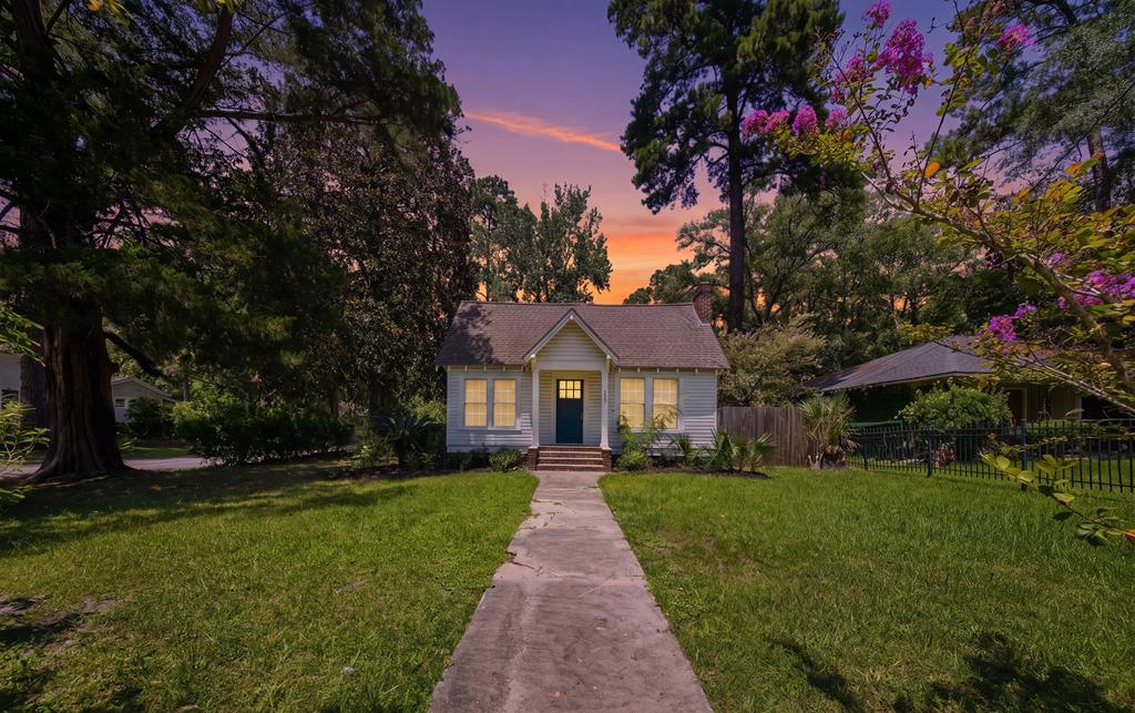 Circa 1924 bungalow featuring 2 bedrooms and 2 bathrooms with hardwood floors throughout on a corner lot. Walk or drive your golf cart to downtown Thomasville or Macintyre park. Master bedroom features a walk in closet and luxury master bathroom with walk in shower. This bungalow also has a home office or sunroom with lots of windows. The back is fenced in with a courtyard area and gravel parking. Unique historical features of this home include original in wall telephone table in hallway and antique fold down ironing table in master bedroom. Home was completely remodeled in 2020. Home sold fully furnished.
