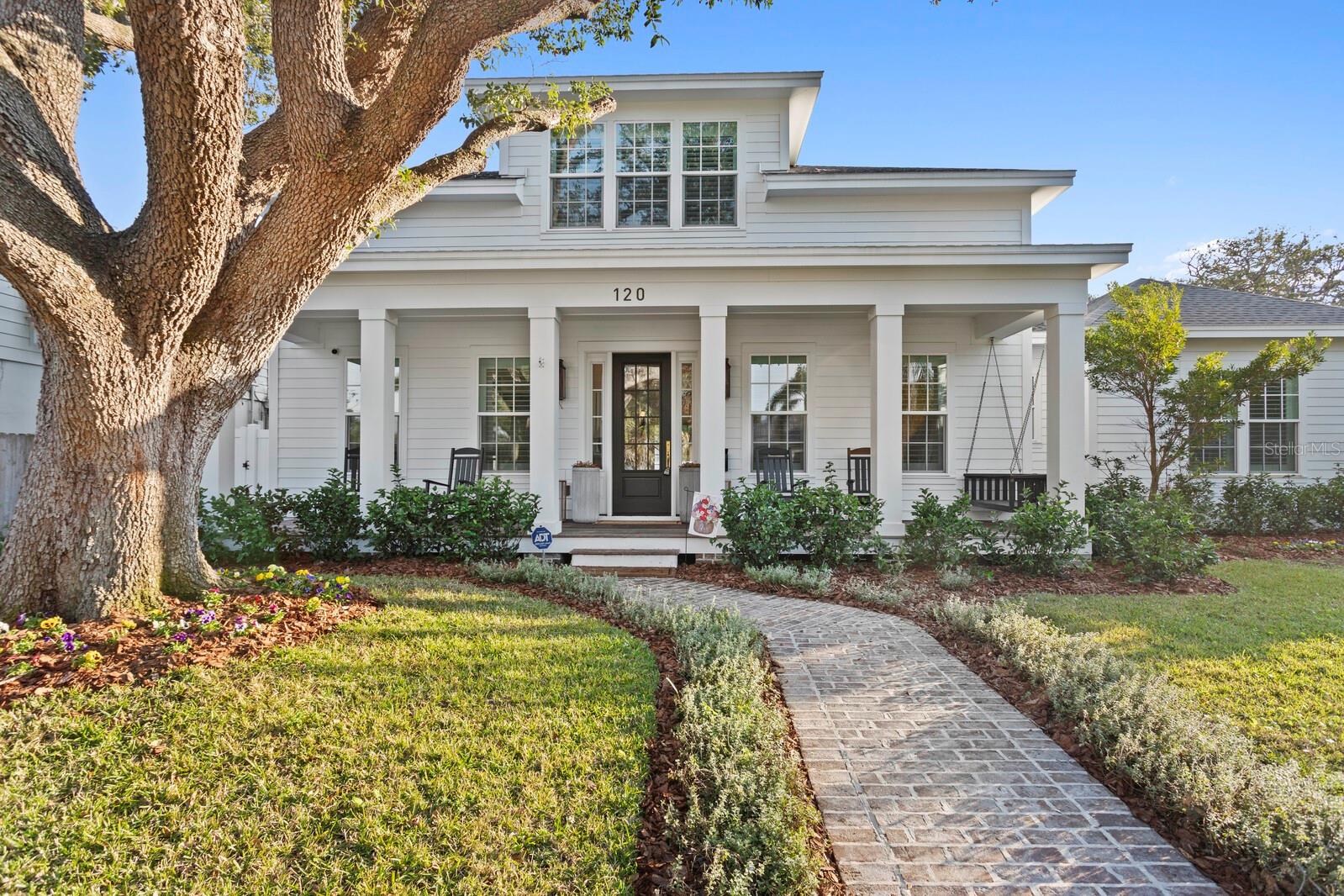 Discover this 2023 Canopy Builders' modern farmhouse home located in Old Northeast, offering a wealth of bespoke features and contemporary elegance. This residence sits on an expansive 9,500+ square foot lot, boasts 4 bedrooms + office/den, 4.5 bathrooms with a generous 3,977 square feet of living space. As you approach, a brick-paved pathway leads to a covered porch adorned with built-in columns. Inside, the home features high coffered ceilings, an open floor plan, a working fireplace, and wood floors throughout, creating a warm and inviting atmosphere. The kitchen is a chef's dream, equipped with granite counters, a breakfast/bar island, built-in shelves, and Thermador appliances. Outside, enjoy a covered living area overlooking the expansive, newly-installed turf yard, situated for relaxation, outdoor activities and entertainment. A breezeway takes you to a thoughtfully designed studio apartment atop the detached garage-- the perfect 'in-law suite' for guests or extended family. Located near the Vinoy Golf Club, the Vinoy Resort, shopping and dining along Beach Dr, and the St. Pete Pier, this home offers the perfect blend of comfort and convenience. Don't miss the opportunity to make this your own—schedule your showing today!