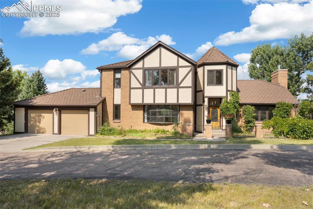 If waking up to Expansive Mountain Views Every Morning is your Dream, Look No More! Impeccably Maintained Home in Award Winning School District 38! Pride of Ownership is Evident Throughout This 3 Bedroom, 3 Bathroom, Nearly 3000 Square Foot Home! The Main Level Serves up a Formal Living Room with a Beautiful Bay Window ~ Family Room with Soaring Ceiling and Handsome Wood Burning Fireplace That Will Warm you on Those Cool Colorado Evenings ~ A Bright Cheery Sunroom Perfect for your Morning Coffee or a Lovely Home Office. The Fully Remodeled, Gourmet Kitchen is Sure to Delight with Sleek Quartz Countertops and Tons of Cabinets for All Your Kitchen Essentials! Walk-out Access to the Patio and Deck from both the Kitchen and Dining Room is a Great Way to Bring the Outdoors in! You will Love Entertaining Friends and Family on the Spacious Deck with Built In Seating! The Laundry Room and a ¾ Remodeled Bathroom Complete the Main Level! Upper-Level Plays Host to 3 Bedrooms Including the Primary Suite as Well as a Beautifully Remodeled Full Bathroom W/Heated Floors! The Primary Bathroom Will Be Your Private Oasis with Stunning Floating Double Vanity, Soaking Tub, Spa Shower and Also Heated Floors! The Roomy Walk-in Closet with Custom Built-ins Will be the Envy of All! 2 Additional Bedrooms One with 2 Closets and Another with a Playful Mini Staircase Leading to it, Finish out the Upper Level! Situated on Just Under 1 Acre ~ Within Walking Distance/Golf Cart Distance to the Woodmoor Country Club and Golf Course! Near Shopping, Schools, Hiking, Restaurants and Oh Those Views!  Welcome Home!