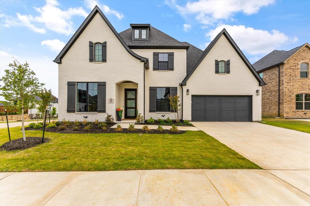 Absolutely Gorgeous New Custom Home in Frisco ISD. This brand-new custom home sits on a premium 85 x 115 ft corner lot, backing to a greenbelt and facing north. The open-concept floor plan features blonde wood flooring throughout the first floor, with the primary suite, guest suite, study, and media room all on the main level. Exterior upgrades include white brick with black window frames and a dark roof. Inside, the home showcases luxury finishes: quartz waterfall island, floor-to-ceiling cabinetry, designer pendant lighting, gold hardware, custom wallpaper, upgraded plumbing fixtures, and $$$ tile and quartz throughout. Additional highlights include modern accent walls, soaring ceilings, wood stairs with iron balusters, shaker-style doors, and gigabit ethernet wiring. The primary retreat offers cathedral ceilings, walls of windows, a freestanding tub, dual vanities, a seamless glass shower, and a spacious walk-in closet. Upstairs, you’ll find two en-suite bedrooms and a large game room. The oversized 2.5-car garage includes epoxy flooring and wiring for cameras and surround sound. Model-home-quality finishes in every detail.