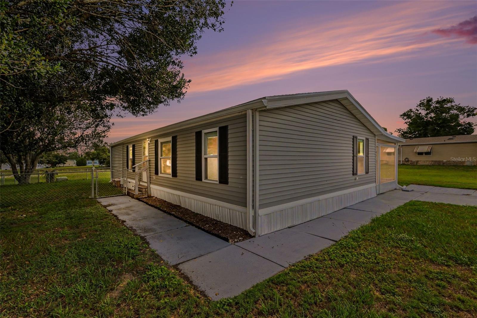 Welcome to carefree Florida living in Brookridge, where you own the land! This 3-bedroom, 2-bath home is located in the highly desirable guard-gated Brookridge Golf & Country Club. With a vacant lot next door and no rear neighbors, you'll enjoy added privacy. Recent updates include a new 2026 water heater, LG 2026 dishwasher, quartz countertops, new appliances, luxury vinyl plank flooring throughout, fresh interior paint, updated bathrooms with new vanities and oversized medicine cabinets for additional storage, plus digital door locks for added security. All windows are equipped with blinds. This home has a split floor plan for guests. The screened porch features a large access door, allowing you to park a golf cart or vehicle underneath. The rear porch includes a durable Trex deck designed to withstand Florida's harsh outdoor conditions. A spacious bonus room provides extra living space and includes the indoor washer and dryer, along with a door featuring a built-in dog door for convenient backyard access. Residents enjoy an active lifestyle with an 18-hole golf course, clubhouse, heated pool, fitness center, tennis, pickleball, shuffleboard, planned social activities, and more, low HOA fees at $55 per month. Beautiful updates, land ownership, added privacy, abundant storage, and resort-style amenities make this move-in-ready home an outstanding opportunity.