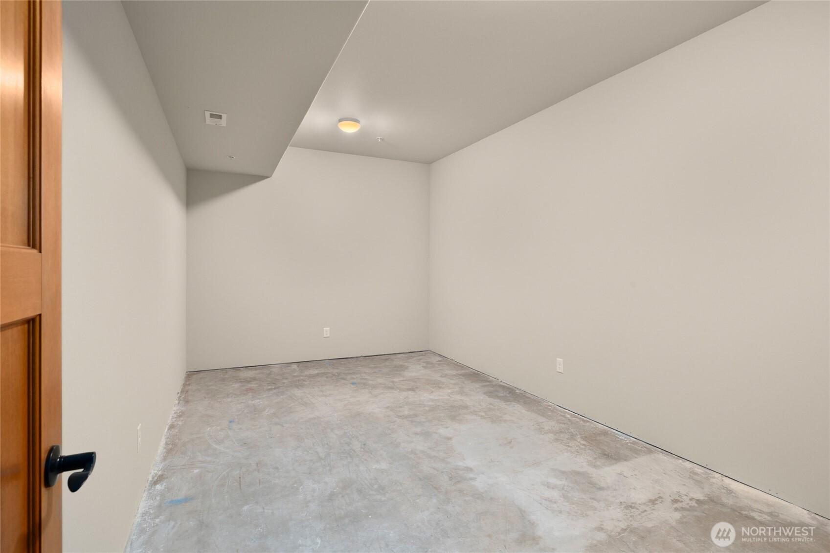 Unfinished room that leaves your imagination to run wild. Make this room into a wine room or a small theater room. Check out the next few  virtually stage photos for this room.
