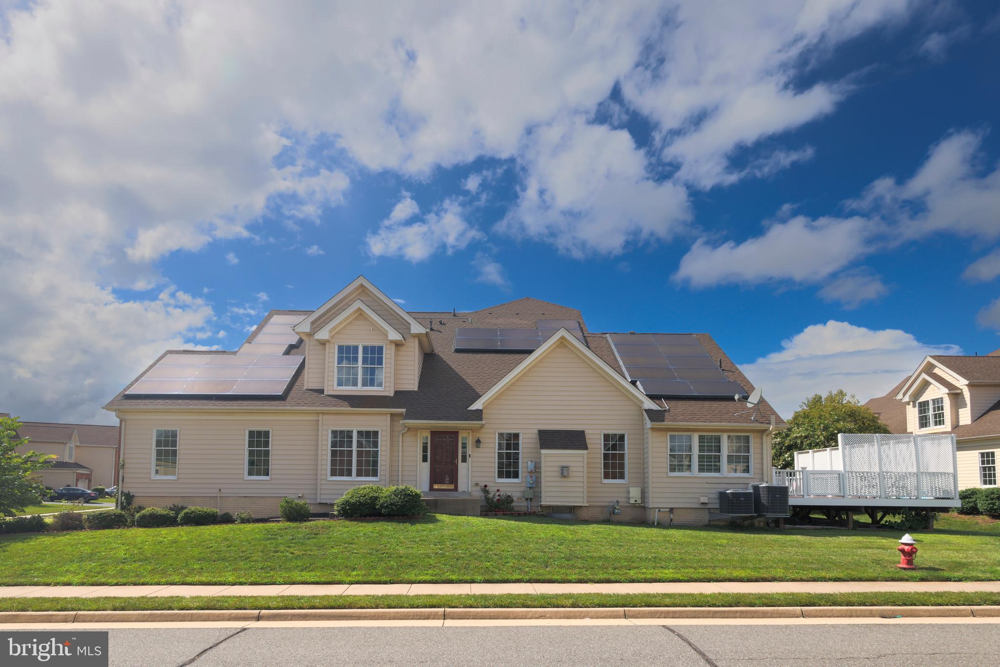 Exceptional carriage style townhome offering over 4,400 square feet of beautifully finished living space in one of Ashburn's most desirable communities. Meticulously maintained and extensively upgraded by both the current and original owners, this move-in-ready residence combines luxury, comfort, energy efficiency, and peace of mind.The main level features an open, light-filled floor plan with elegant finishes, spacious living and dining areas, and a gourmet kitchen equipped with newer stainless steel appliances, an upgraded range hood, dishwasher, and beautiful Silestone countertops. Fresh interior paint and professionally refinished kitchen cabinetry provide a modern, updated feel throughout.Recent improvements completed by the current owner include a new sump pump with battery backup system (2025), an active radon mitigation system (2025), a new MyQ smart garage door opener with battery backup, a newly added staircase providing direct access from the deck to the backyard, and rear gutter improvements.Major capital improvements completed by the original owners include both HVAC systems replaced in 2024, upgraded attic insulation for improved energy efficiency, and a spacious deck ideal for outdoor entertaining. The basement kitchen will include a stove prior to settlement, adding flexibility for guests, extended family, or entertaining.The fully finished lower level offers an exceptional entertainment experience featuring a premium Bose surround sound system and projector that convey with the home, creating a true home theater environment.The property is also equipped with a Tesla solar panel system that may be reactivated at the buyer's preference, providing the opportunity for future energy savings.With extensive mechanical updates, premium entertainment amenities, quality improvements throughout, and outstanding pride of ownership, this exceptional residence offers the perfect combination of elegance, functionality, and long-term value in a prime Ashburn location.