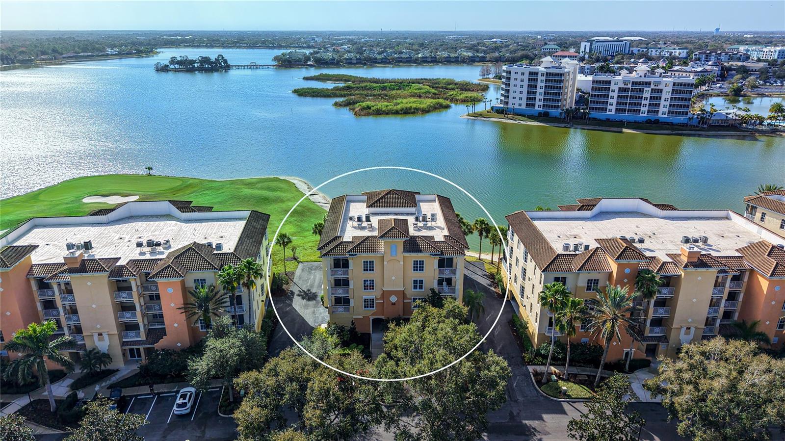 Welcome home to the resort-style Watercrest Condominium, where a beautifully landscaped entrance welcomes you with sweeping views of the 160-acre Lake Uihlein and the Legacy Golf Course. For the discerning buyer, the highly sought-after end unit Sanctuary model is now available. This residence is tucked within an intimate, private six-unit building surrounded by impeccably maintained grounds and ideally located just a short walk from the fitness center, heated pool, and the newly remodeled community clubhouse.A private oversized 2-car garage provides direct access to the secured lobby, where a semi-private elevator brings you to the third floor. Step into your private foyer and through double entry doors to discover an immaculately maintained 2,482-square-foot home with stunning lake views. Expansive windows, sliding doors, and a generous screened terrace fill the spacious great room and elegant dining room—complete with natural light.The kitchen features solid wood cabinetry, granite countertops, island with storage, a floor-to-ceiling pantry, and large windows. Adjacent to the kitchen is a well-appointed laundry room with a sink, cabinetry, and storage closet.The owner’s retreat, located just off the main foyer behind double doors, offers terrace access and tranquil lake views. This suite includes two custom walk-in closets and a totally remodeled spa-like bath with dual quartz countertop vanities, an oversized shower, a stunning custom bathtub, and a private water closet. On the opposite side of the home are two guest suites, each with en-suite baths, terrace access, and peaceful preserve views. Additional features include tray ceilings, custom draperies, new light fixtures and ceiling fans, blackout curtains in primary and bedroom #2,  2019 Carrier AC unit, 2019 hot water heater, 2023 LG washer and dryer, 2025 stainless LG double oven 5 burner range, 2017 Bosch dishwasher,  and a recently finished epoxy garage floor. Mohawk hardwood floors in all three bedrooms(2025) and they continue to flow into the family room.Watercrest offers the perfect blend of privacy and convenience. Within half a mile, you’ll find Lakewood Ranch Medical Center, I-75, and UTC Mall. Downtown Sarasota and the area’s renowned beaches are just a short drive away. The community is also within walking distance of Lakewood Ranch Main Street, home to a movie theater, shopping, mini golf, exceptional dining, and year-round events. Best of all, Watercrest provides a serene lakefront setting where resort-style amenities meet peaceful, private living.