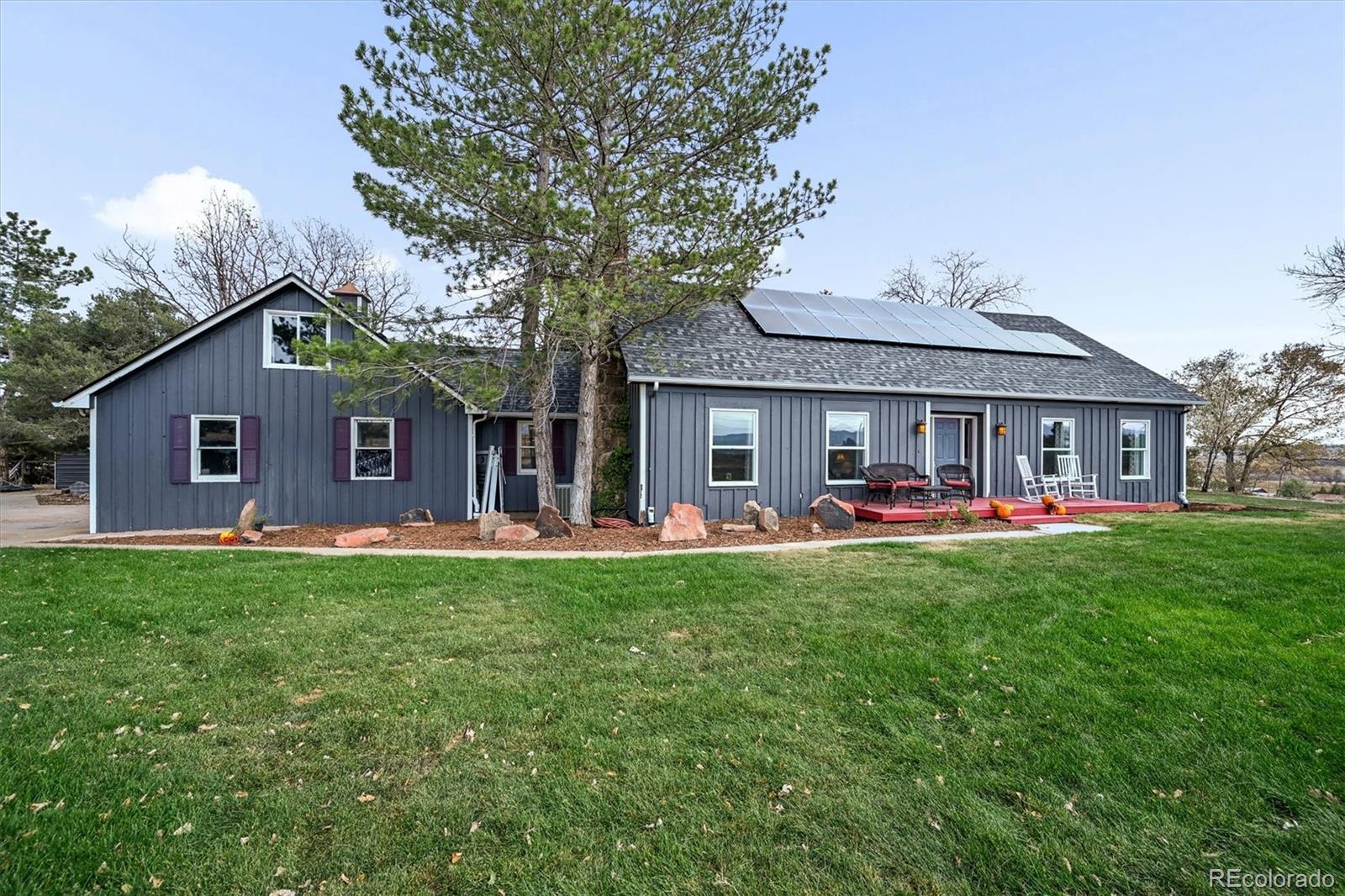 Discover the perfect blend of country living and modern comfort in this highly desired Phillips Rd. neighborhood  boasting  panoramic mountain views from Longs Peak to Pikes Peak, this property offers unmatched natural beauty and a peaceful lifestyle-all within an easy commute to Boulder and Longmont. Set on open space with no HOA and agricultural zoning, this versatile property is ideal for a homestead, farm, or multi-generational living. The main home is thoughtfully designed to accommodate extended family or guests, offering flexibility and comfort for all. Outdoors, you'll find everything needed for country living at its finest-including a fruit and vegetable garden, chicken coop, and cistern with nonpotable water for drip irrigation, plus field irrigation materials included. There's plenty of room for RV and multiple outbuildings, including a barn with a workshop that could easily be converted back to stalls, and a metal building perfect for a shop or additional covered parking. Enjoy easy access to horseback riding, biking, and hiking trails right from your doorstep, along with excellent road access for farm stand potential or equipment deliveries. Modern upgrades include a new roof, new sprinkler system, and owned solar panels to keep energy costs low. Unwind at the end of the day in your private hot tub with beautiful surroundings. Located in desirable Boulder Valley School District and near Dawson Private School, this property offers both tranquility and convenience- a rare opportunity to live the Colorado dream!