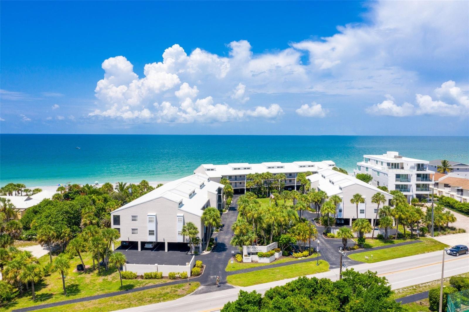 If you have been looking for beachfront living, then look no further. PELICAN LANDING ON MANASOTA KEY is a Gulf-to-Bay condominium community where the Gulf and Lemon Bay are both part of your Florida lifestyle. Located on the Gulf side of the community, this 2-bedroom, 2-bath condominium features an expanded living area with an enclosed lanai, a peek-a-boo GULF VIEW from the kitchen window, ELEVATOR ACCESS, and convenient UNDER-BUILDING COVERED PARKING. The light and bright interior offers an open living and dining area, tile flooring throughout the main living spaces, white kitchen cabinetry, beautiful counters, a spacious breakfast bar, and an in-unit stacked washer and dryer. Step outside and enjoy approximately 285 FEET OF PRIVATE BEACH ACCESS along the Gulf of Mexico, perfect for morning walks, searching for shells and shark teeth, or watching spectacular Southwest Florida sunsets. Pelican Landing offers an impressive collection of amenities spanning from the Gulf to Lemon Bay, including a BEACH-SIDE HEATED SWIMMING POOL AND SITTING AREA, CLUBHOUSE, TENNIS COURTS, COMMUNITY BOAT DOCKS, and FISHING PIER. Elevator access and under-building parking add everyday convenience to island living. The community continues to be refreshed, with NEW RAILINGS already installed and PARKING LOT RESURFACING currently underway. Manasota Key is open and ready to enjoy, with Englewood Beach, local restaurants, and island businesses nearby. Beyond the Key, you are close to shopping, fabulous local dining, golf courses, and everything the greater Englewood area has to offer. Boating and world-class fishing are at your doorstep, with Lemon Bay, the Intracoastal Waterway, and the Gulf all within easy reach. Whether spending the day on the beach, boating the waterways, dining on Manasota Key, or simply enjoying the Gulf breeze from home, 2700 N Beach Road #A105 offers the opportunity to experience the coastal Southwest Florida lifestyle at PELICAN LANDING ON MANASOTA KEY.