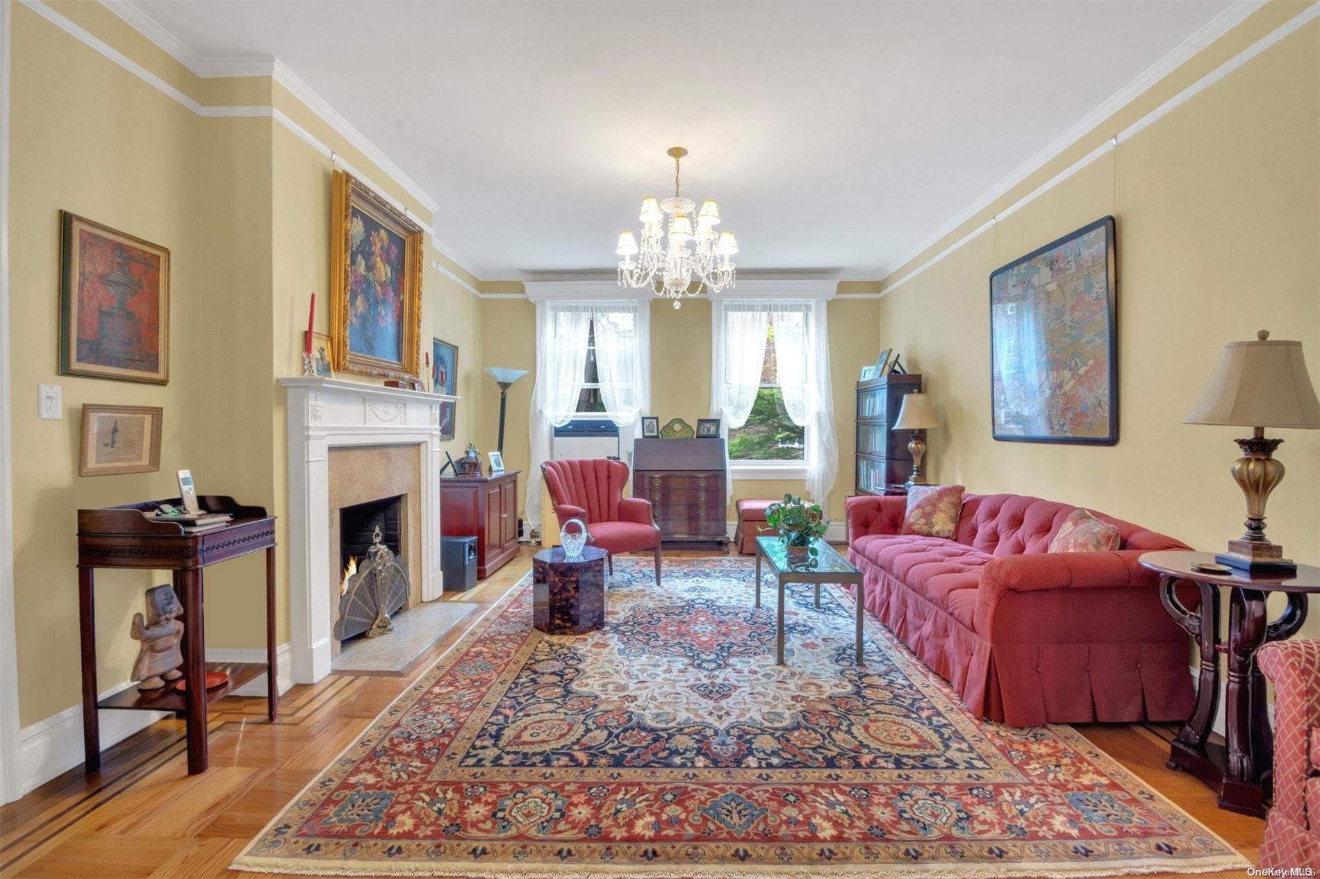 Superb 3-bedroom, 2-bathroom garden co-op in the premier Landmarked Elm Court! It is located on 80th street, between 34th and 35th avenues in the heart of Historic District, only 4.5 blocks from #7 train. The Elm Court was built by the famous architect George F. Wells in 1922 as epitome of luxurious living. This well-appointed, classic 2nd floor 6-room apartment consists of the living room with wood-burning fireplace, formal dining room, 3 bedrooms, 2 bathrooms and the kitchen. It features 9 ft. ceilings, parquet floors with inlays, original moldings and plaster walls. Very airy apartment with 12 windows, many of which are oversized, and 3 serene exposures facing both 80th street and the lavish internal garden. The laundry room is in the basement, as well as a large, private storage room at no charge that comes with the unit. This is a 4 story building with an elevator opening directly into your apartment, marble staircases, only 2 apartments per floor and the magnificent internal courtyard. Maintenance $1250, 33% down, no dogs, cats ok, no smoking, live-in super. The biggest attraction in the area is the Travers park and it is located only couple of blocks away. It has a beautiful grassy hill, several playgorunds for children, a dog run, basketball, paddle ball & tennis courts courts, sitting areas. The 34th avenue is used only by pedestrians and bicycles from 69th to 94th streets. Every Sunday there's a famous Farmer's market at 79th street, that is open year-round.  Combined, it creates the unique sense of community, not available in many other parts of the city.