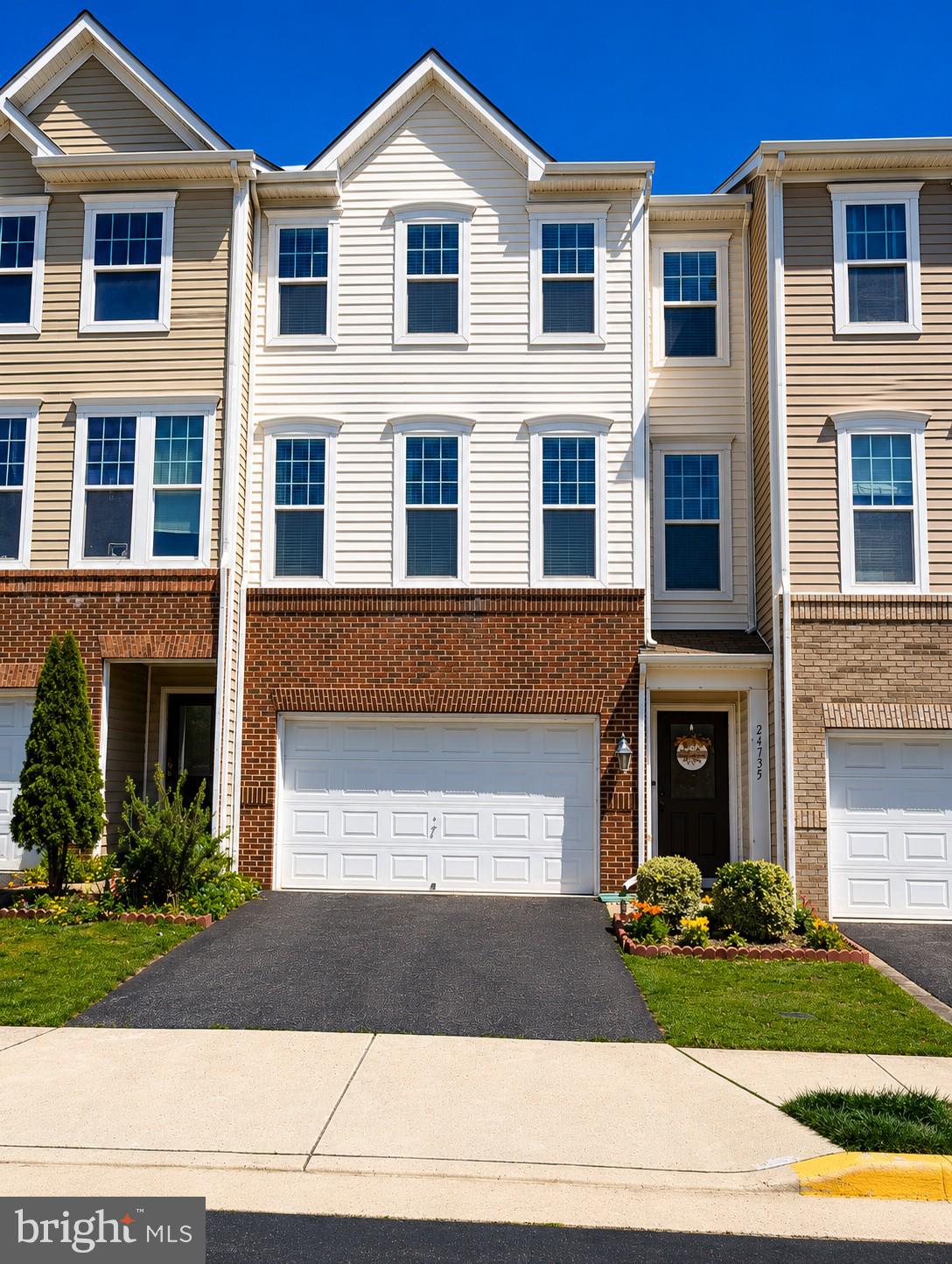 Welcome to this beautiful, move-in-ready three-level townhome in the heart of Stone Ridge! From the moment you enter, you'll appreciate the versatile lower level featuring a spacious recreation room, walkout basement access, and a full bath. This level offers excellent flexibility and can easily accommodate a fourth bedroom by adding a wall if desired. The main level showcases gleaming hardwood floors and an open-concept layout designed for both everyday living and entertaining. Enjoy a spacious family room with a cozy gas fireplace, a casual dining area, and a well-appointed kitchen featuring granite countertops, stainless steel appliances, and ample cabinet space. Upstairs, the expansive owner's suite provides a relaxing retreat with a tray ceiling, dual walk-in closets, and an updated en-suite bath featuring dual vanities and a large walk-in shower. Two additional generously sized bedrooms, a full hallway bath, and the convenience of upper-level laundry complete the top floor. Perfectly situated, this home is within walking distance of Goshen Post Elementary, and John Champe High School. Enjoy being just steps from Stone Ridge Village Center with its shopping, dining, and everyday conveniences, as well as the Dulles South Stone Ridge II Park & Ride for an easy commute. Offering comfort, convenience, and an exceptional location, this beautiful home presents a rare opportunity in one of Loudoun County's most sought-after communities. Come fall in love and make this wonderful home yours! Photos may be virtually staged
