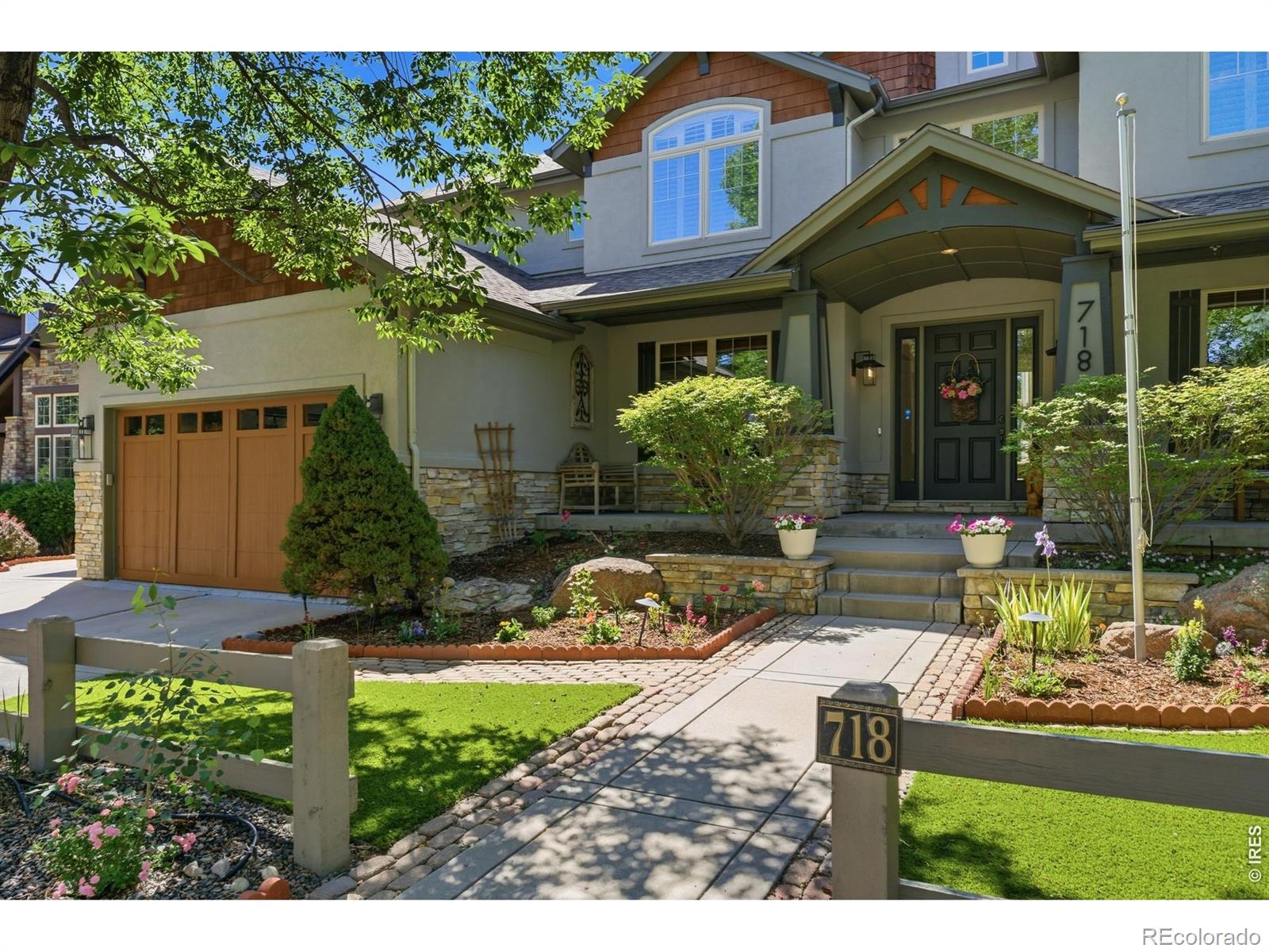 Backing directly to the golf course in one of Lafayette's most sought-after neighborhoods, this Indian Peaks stunner has it all - 5 beds, 5 baths, hardwood floors, soaring ceilings, a chef's kitchen. Wolf gas range, a backyard made for long summer evenings, a finished basement with home theater, 2 main-level offices & a primary suite with its own walk-out deck. Colorado living, fully unlocked. The main level delivers a gas fireplace, giant windows framing the fairways, and a kitchen loaded with a commercial hood, KitchenAid appliances, double oven, large island, pantry, & coffee nook. Out back, all-new stonework, a spacious pergola, built-in grill, water feature, and low maintenance artificial turf keep it looking sharp year-round. Upstairs, the primary suite offers an oversized bath and huge walk in closet. Two bedrooms share a Jack and Jill bath, a third has its own en-suite, & a conveniently located laundry room sits steps from the primary bedroom. Downstairs, the basement brings the goods - home theater, exercise room, 5th bedroom, 3/4 bath, & bonus space that could easily become a suite or kitchenette. New LVP flooring in the main area and exercise room. Updated furnaces & A/C, 3-car garage, Nest thermostats, Yale electronic front door lock. Easy access to trails, downtown Lafayette, & the Denver/Boulder corridor.