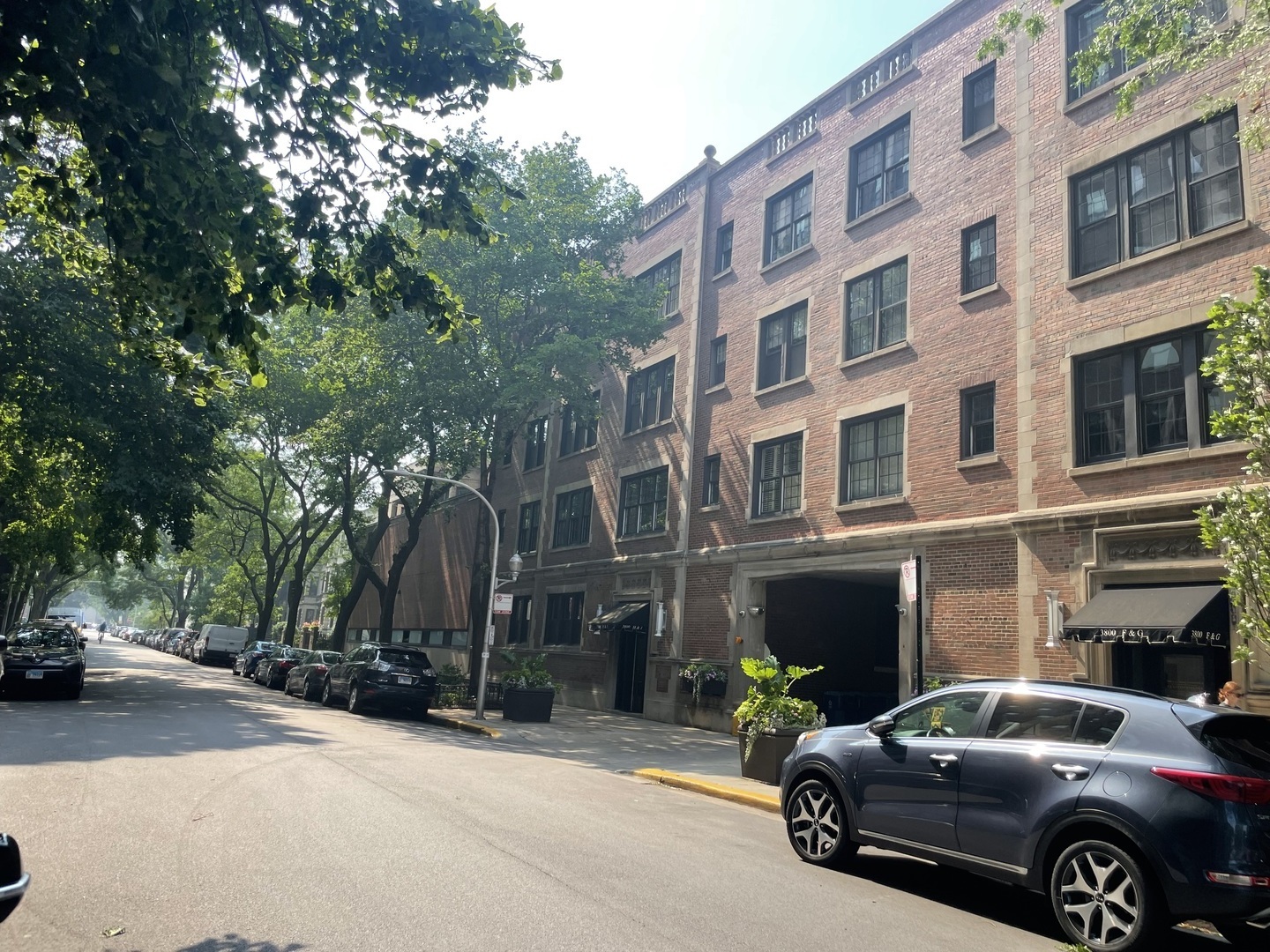 Estate Sale Opportunity - Spacious 3BR Condo by the Lake!  Welcome to your new home! This jumbo-sized 3-bedroom, 2-bath condo offers generous living space, classic vintage charm, and endless potential to make it your own. Featuring hardwood floors throughout, a cozy fireplace, and stunning city views-including a peek at the lake-this unit combines character and comfort.    Enjoy the convenience of included parking, and take advantage of the unbeatable location: just steps from the lakefront, the Red Line, multiple bus routes, grocery stores, and all the dining and nightlife Wrigleyville has to offer.    Whether you're looking to move right in or customize to your taste, this is a fantastic opportunity in a prime city neighborhood!