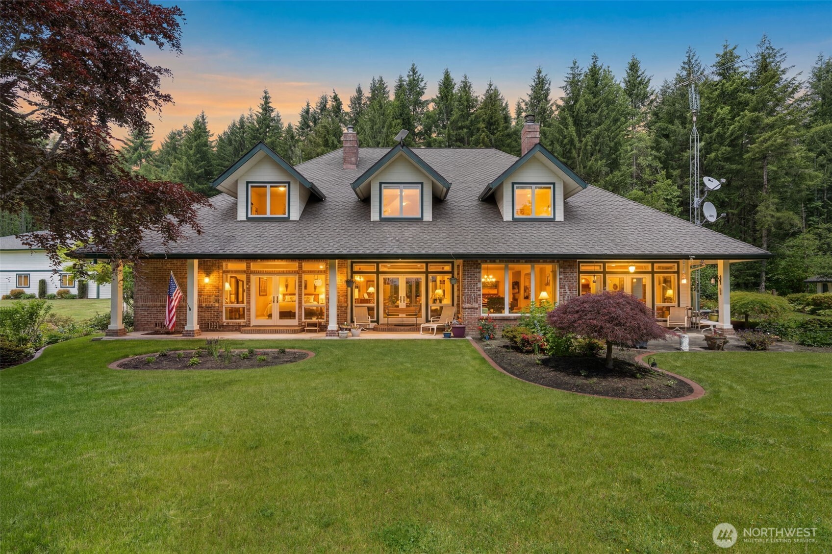 Welcome to this exceptional custom home offering 4,212 square feet of thoughtfully designed living space on 12.7 private acres. Located at the end of a gated private road, this property provides a peaceful setting with the convenience of being just 7 minutes from I-5, the Centralia-Chehalis Airport, Providence Centralia Hospital, shopping, dining, and other local amenities.The home features 4 bedrooms, 3 full bathrooms, and 2 half baths. The main-level primary suite includes a fireplace, walk-in closet, and five-piece bath. Upstairs are three additional bedrooms, two bathrooms, a half bath, and abundant storage. Large windows throughout capture natural light and views of the mature landscaping.The kitchen is equipped with custom cabinetry, quartz countertops, a 5-burner gas range, double ovens, walk-in pantry, and Sub-Zero refrigerator. Additional features include three fireplaces, a dedicated office with built-in desk and cabinetry, a covered porch, and a 4-car garage.Outdoor amenities include a 45' x 75' croquet court/sport court/shop building, a separate 28' x 36' woodworking shop/garage, raised garden beds, decorative pond, spacious deck with hot tub, and ample parking for vehicles, equipment, and recreational vehicles. Approximately 10 acres are enrolled in forest tax classification, enhancing privacy and the natural setting.A rare opportunity to enjoy acreage living with exceptional amenities, workspace, and convenient access to Centralia and Chehalis.