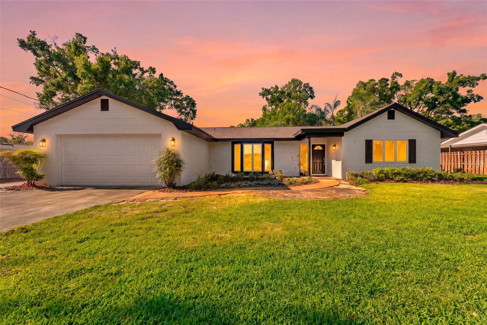 Available for the first time in nearly 45 years, this beautifully maintained 5-bedroom, 2-bathroom home offers a versatile split floor plan and is ready for its next chapter. Situated on nearly 1/3 of an acre in one of Lake Magdalene’s most sought-after neighborhoods, the property blends space, charm, and lifestyle—complete with optional HOA access to a private boat ramp on 252-acre Lake Magdalene, perfect for boating, kayaking, and fishing. Designed for flexibility, the home features five true bedrooms, a dedicated office, and a spacious enclosed, air-conditioned Florida room—ideal for entertaining, working from home, or multigenerational living. Inside, you’re welcomed by original terrazzo flooring and a warm, inviting foyer that sets the tone throughout. Recent improvements enhance both curb appeal and comfort, including over $30,000 in professional landscaping with new sod, plants, and a well-fed irrigation system—keeping the yard lush year-round without increasing your water bill. The exterior has been freshly painted in Sherwin Williams Alabaster for a clean, timeless look, while interior updates include Sherwin Williams Alabaster throughout the entire home, new carpet in one bedroom, and tasteful updates to both the primary and guest bathrooms. Major updates include a new roof (November 2023) with a transferable 10-year warranty, well-fed irrigation system (2026), full interior and exterior paint (2026), updated primary bathroom (2026), and Anderson windows in the Florida room (2024). The kitchen range, dryer, and water heater are all gas. With its rare combination of size, location, and private lake access, this is a unique opportunity to own a home that has been lovingly cared for and thoughtfully updated.