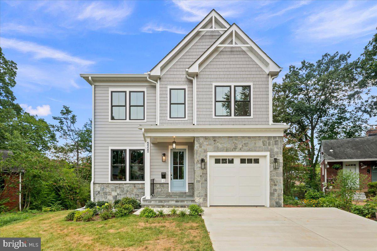 Tucked at the end of a cul-de-sac in Dominion Hills, 5900 9th Street N is a newly completed home by local builder Enhanced Homes, offering 4,480 square feet of thoughtfully designed living space across three finished levels.The main level features 10-foot ceilings, hardwood floors, and an open layout designed for both everyday living and entertaining. The kitchen includes warm wood cabinetry, a contrasting navy island, quartz countertops, a statement tile backsplash, stainless steel appliances, and a large walk-in pantry. It flows seamlessly into the dining area and spacious family room, where a gas fireplace creates a natural gathering place. Sliding glass doors open to a screened porch and adjoining rear deck overlooking the backyard. A private office with custom navy built-ins, a powder room, and a well-appointed mudroom off the garage complete the level.Hardwood flooring continues throughout the upper level. The expansive primary suite features a vaulted ceiling, two walk-in closets, and a spa-inspired bath with dual vanities, a freestanding soaking tub, and an oversized glass-enclosed shower. Three additional bedrooms, two full baths, and a centrally located laundry room complete the upper level.The bright walk-out basement is finished with durable luxury vinyl plank flooring and offers a large recreation room, wet bar, exercise room, fifth bedroom, full bath, and direct access to the backyard—ideal for entertaining, overnight guests, or a private living space.Located just blocks from Bluemont Park, Upton Hill Regional Park, and the Bon Air Rose Garden, with convenient access to Ballston, East Falls Church, and nearby commuter routes. The home is backed by a one-year wall-to-wall builder warranty and a five-year structural warranty.