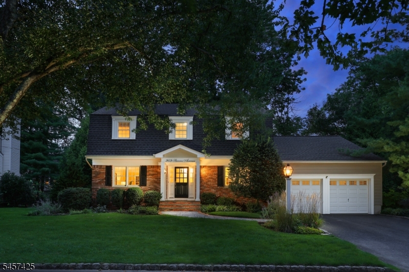 Nestled along a peaceful, tree-lined street, this beautifully maintained 4-bedroom, 2.1-bath Center Hall Colonial blends timeless style with comfortable modern living. Ideally located just minutes from highly regarded Washington Grade School, recognized for its Blue Ribbon excellence, this freshly painted home offers an inviting layout designed for both everyday living and entertaining. The first floor features gracious formal living and dining rooms, while the spacious kitchen with center island and breakfast area opens seamlessly to the family room, where a wood-burning fireplace creates a warm and welcoming gathering space. A powder room and convenient laundry area complete the main level. Upstairs, retreat to the generously sized primary suite with a private en suite bath. Three additional spacious bedrooms and a full hall bath complete the second floor. The finished lower level adds valuable living space with endless possibilities for a recreation room, home office, gym or playroom. Outside, the private backyard and patio provide the perfect setting for al fresco dining, entertaining or relaxing. A two-car attached garage completes this wonderful home, offering the ideal combination of space, comfort and location.