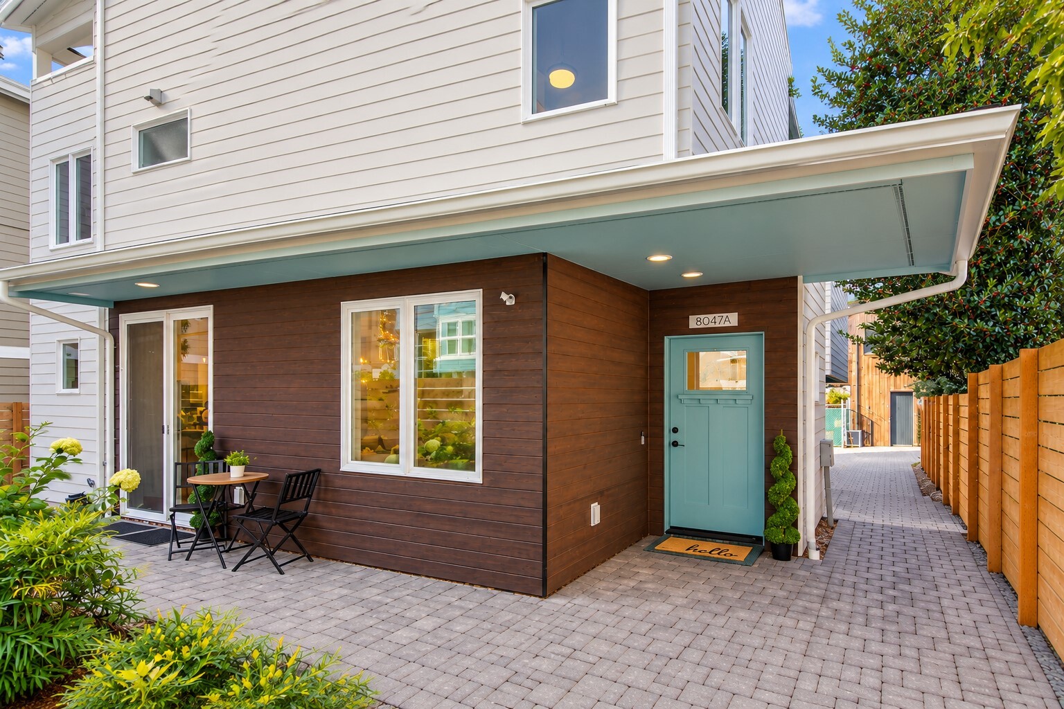 Discover elevated urban living in Seattle’s coveted Crown Hill neighborhood! Built in 2023, this stunning 1,810sf stand-alone, 3-story home blends sophisticated design, luxurious finishes & exceptional indoor-outdoor living. Sunlight pours into the spacious open-concept main level, where inviting living & entertaining spaces flow effortlessly into a chef-inspired kitchen showcasing sleek cabinetry, striking fixtures, premium appl, breakfast bar & walk-in pantry. Ductless A/C adds year-round comfort, while a stylish powder room & spectacular wraparound patio courtyard make hosting a delight. The 2nd level offers 2 spacious guest bedrooms, a beautifully appointed full bath & a dedicated laundry rm with W/D. Above it all, the entire 3rd floor is devoted to an extraordinary primary retreat. Vaulted ceilings & sun-filled southern windows create an airy ambiance, complemented by 2 generous walk-in closets & a spa-inspired ensuite featuring custom finishes, lrg dual-sink vanity, oversized walk-in shower, & private water closet. Just steps away, your own covered rooftop balcony awaits, complete w/custom flooring & recessed lighting-an idyllic setting for morning coffee, evening relaxation or memorable gatherings.  A private off-street parking space completes this exceptional offering. Convenient access to shopping, dining, live music, Golden Gardens, Fremont, DT Seattle, I-5 & Hwy 99. Modern luxury, effortless convenience & an enviable Seattle lifestyle—all in one remarkable home!