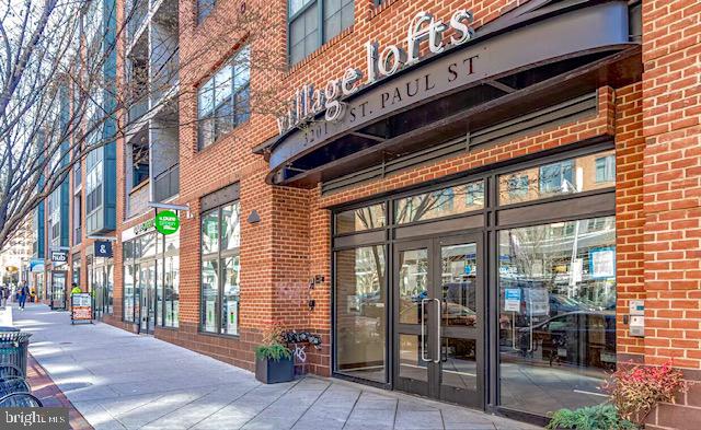 Spacious 2 bed, 2 bath condo located just steps from Johns Hopkins University (2 blocks to be exact) and close to several other colleges and hospitals. This light-filled unit features hardwood floors, large windows, and an open layout. Both bedrooms are generously sized with ample closet space and ensuite baths . Enjoy the convenience of assigned garage parking, secure building access, a mail/package room, and elevator service. Prime location in Charles Village with easy access to dining, shops, and public transportation. Great opportunity for investors or owner-occupants alike. Could rent for $3,500 a month. Deeded Parking space is P2 space #22, Storage #55. Pet policy is 1 Dog, OR 2 cats, OR 1 dog and 1 cat, OR 2 Dogs, OR 3 caged birds  collectively not more than 60 lbs total.