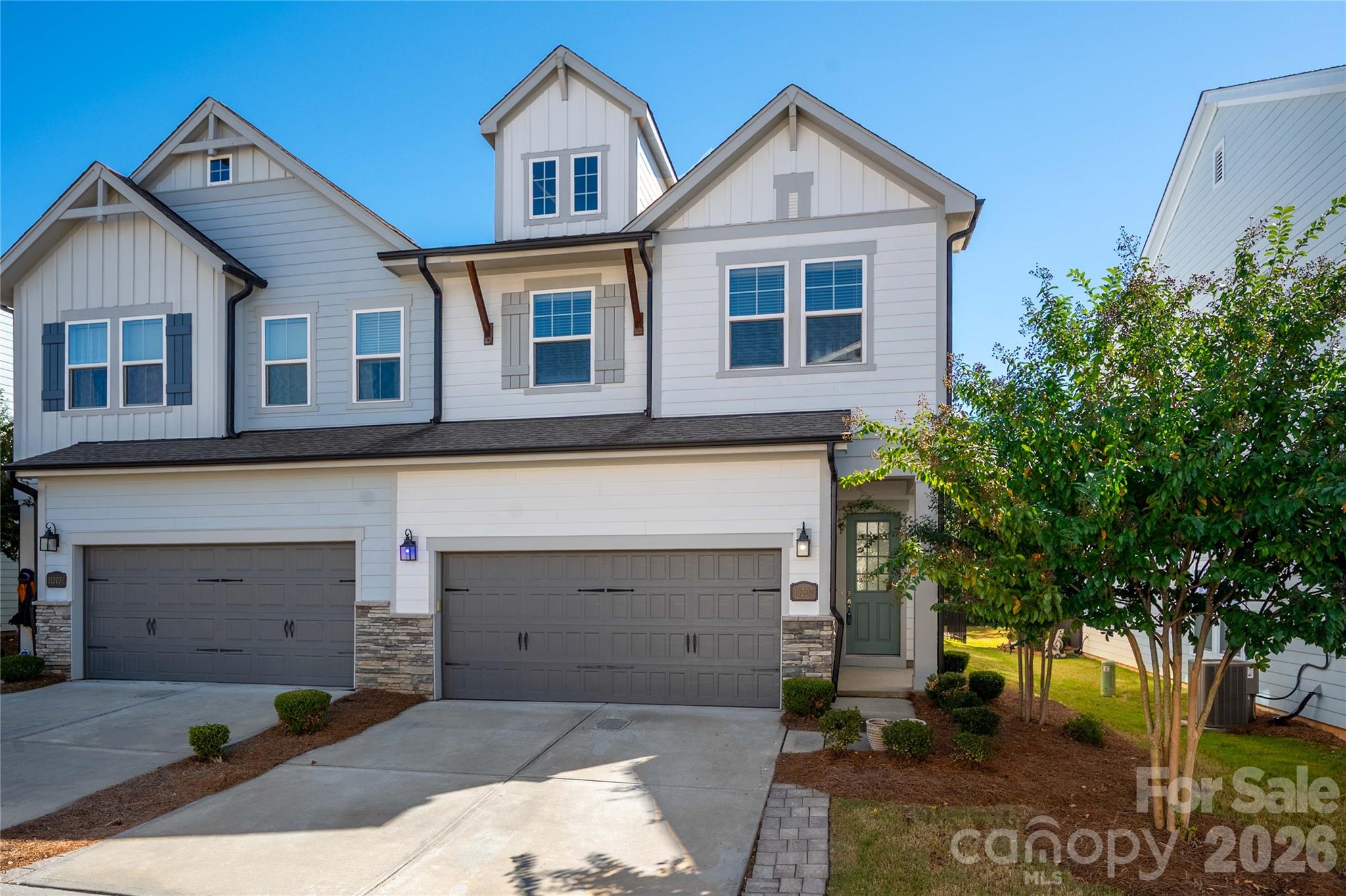 Welcome home to this beautifully maintained, move-in ready paired villa in an incredible Ballantyne location! Featuring 4 bedrooms and 2.5 baths, this light-filled home offers an open floorplan perfect for everyday living and entertaining. The spacious kitchen boasts quartz countertops, stainless steel appliances, a large island, and seamless flow into the inviting living and dining areas. Abundant windows fill the home with natural light, while beautiful wood floors throughout and fresh interior paint add to its appeal. The generously sized primary suite features an elegant boxed ceiling, a luxurious oversized bath, and a spacious walk-in closet with custom built-in shelving. Enjoy the privacy of a fenced backyard with a paver patio, the convenience of a 2-car garage, and low-maintenance living with lawn maintenance included! Ideally located near Ballantyne's fabulous shopping, dining, and entertainment, including the popular Ballantyne Bowl, with easy access to I-485 and Charlotte Douglas International Airport. A wonderful opportunity in one of Charlotte's most desirable areas!