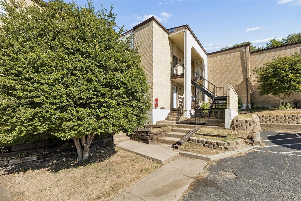 Enjoy an impressive amount of space, storage, and flexibility at 6032 Westridge Lane #212 in Fort Worth’s Ridglea area. Located on the second floor, this condominium offers a spacious layout designed to make everyday living, entertaining, and working from home feel effortless. Two generous living areas create plenty of room to spread out, with a white brick wood-burning fireplace bringing warmth and character to the main gathering space. A formal dining room plus a secondary dining area offer added flexibility for meals, entertaining, or creating a space that fits your needs. The galley kitchen is bright and inviting with white cabinetry, light countertops, and wood-finish flooring. The spacious bedrooms continue the home’s emphasis on comfort and storage, each featuring oversized closets. With 2.5 bathrooms and a dedicated full-size laundry room, the layout delivers practical conveniences that can be hard to find in condominium living. Outside, a large covered wooden balcony extends the living space and offers a comfortable spot for morning coffee or unwinding at the end of the day. The Ridglea location puts everyday destinations within convenient reach. Camp Bowie Boulevard offers nearby restaurants, shopping, groceries, and services, while Ridglea Country Club and destinations throughout Fort Worth are also easily accessible. Convenient access to Interstate 20 provides connections to downtown Fort Worth and the greater Dallas-Fort Worth area. Adding to the convenience, the HOA includes gas, water, sewer, trash, and exterior maintenance, helping simplify ownership and monthly planning. If you’re looking for a Fort Worth condominium with substantial living space, abundant storage, covered outdoor living, and convenient access to the city, this one deserves a closer look. Schedule your private showing today.