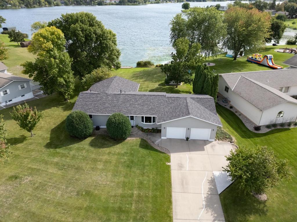 That's life with 101 feet of lake frontage — this walk-out rambler sits on a level .48-acre lot with the water right in your backyard. Start mornings on the deck with your coffee, watch the light dance across 2,126-acre Big Sauk Lake, and let the sunset tell you when it's time to slow down.Inside, it's open and easy. The large primary suite is your retreat, and the finished walk-out basement gives everyone room to spread out — with doors that lead straight to the lake. The oversized two-stall garage swallows kayaks, fishing gear, and everything in between. Come see it for yourself, You'll want to stay for the sunset.