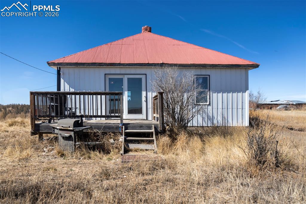 Experience peaceful country living on this expansive 35-acre homestead in Matheson, Colorado. The charming ranch-style home features 2BRs, 1BA, & approx 1,240 sf of comfortable, main-level living space, surrounded by wide-open skies & sweeping views of the eastern Colorado plains. Inside, the home offers an inviting & practical layout w/ attractive wood laminate flooring throughout. The living area has a wood-burning stove (not currently installed) & lighted ceiling fan, & flows easily into a functional kitchen equipped with ample cabinetry, a dishwasher, range oven, & refrigerator. 2 cozy BRs provide a relaxing primary retreat & a versatile 2nd BR ideal for guests, family, or a home office. A bathroom with a walk-in shower & a convenient laundry area with washer & dryer complete the efficient main-level. The hot water heater, cistern pump, furnace & pressure tank are housed in the outdoor cellar area. Step outside to enjoy the privacy & possibilities that rural living provides. This horse-zoned property incl partial fencing, trees & essential rural utilities, incl a 1,000-gallon cistern, well, & 500-gal propane tank. The property also features a storage shed for tools & equipment, & an 1,800-sf garage/workshop w/ ample room for RV or small boat parking. The land offers endless opportunities for animals, gardening, outdoor recreation, or future improvements. Relax on the wood deck & take in unobstructed views of the beautiful Colorado prairie, where you’ll enjoy breathtaking sunrises, colorful sunsets, & brilliant star-filled night skies. Conveniently located within a short drive of the cities of Simla & Calhan, & within reach of Colorado Springs & the Denver metro area, this property combines the serenity of rural life with access to nearby amenities. Whether you're searching for a quiet full-time residence, a farm, or a peaceful weekend getaway, this Matheson ranch style home offers space, tranquility, & the chance to enjoy the beauty of Colorado’s countryside.