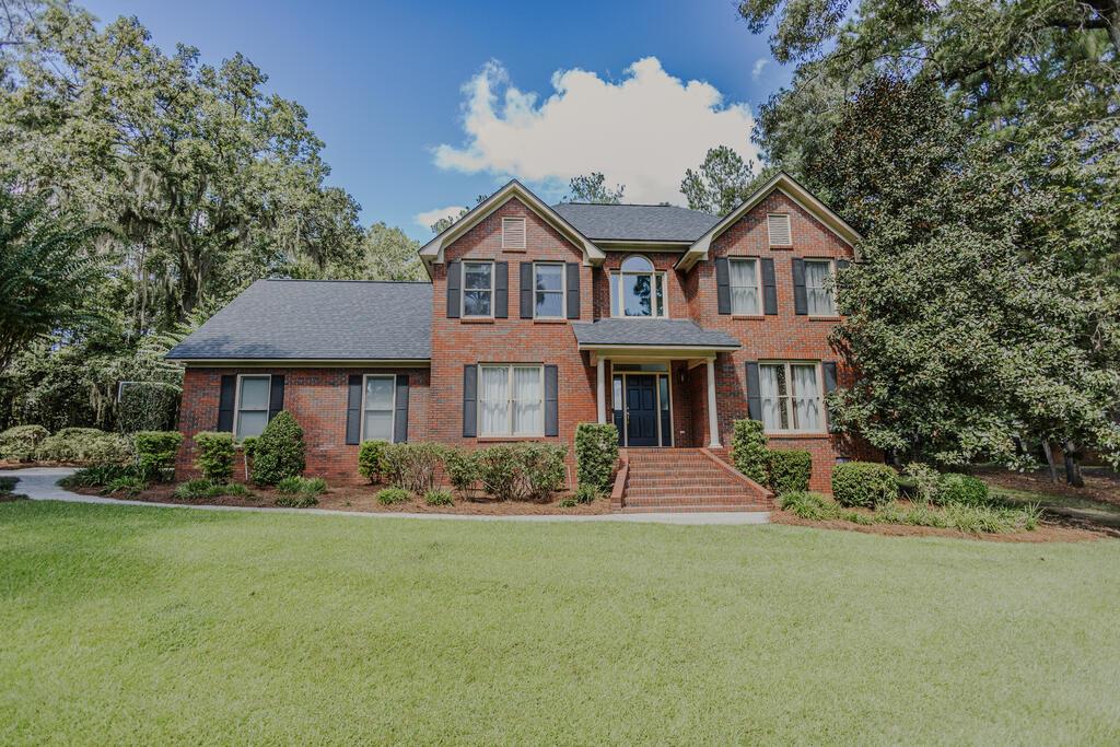 Beautifully tucked into the woods, this home offers privacy, comfort, and exceptional amenities. Recent upgrades include a new roof, septic drain field, appliances, pool pumps, gas tankless water heaters, and a full-perimeter invisible fence.  The insulated, heated and cooled garage features a side-mounted opener for full ceiling-height access. Inside, enjoy custom cabinetry, wired speakers throughout most of the home and to the pool area, a game room with a tongue-and-groove wood ceiling, and a full marble bath with a steam shower, lighting, and aromatherapy.  Outside, the pool features water features and a heater, complemented by landscape lighting, a sprinkler system, and an in-ground gas tank. A private wooded setting, thoughtful upgrades, and outstanding spaces for relaxing and entertaining make this home truly special.