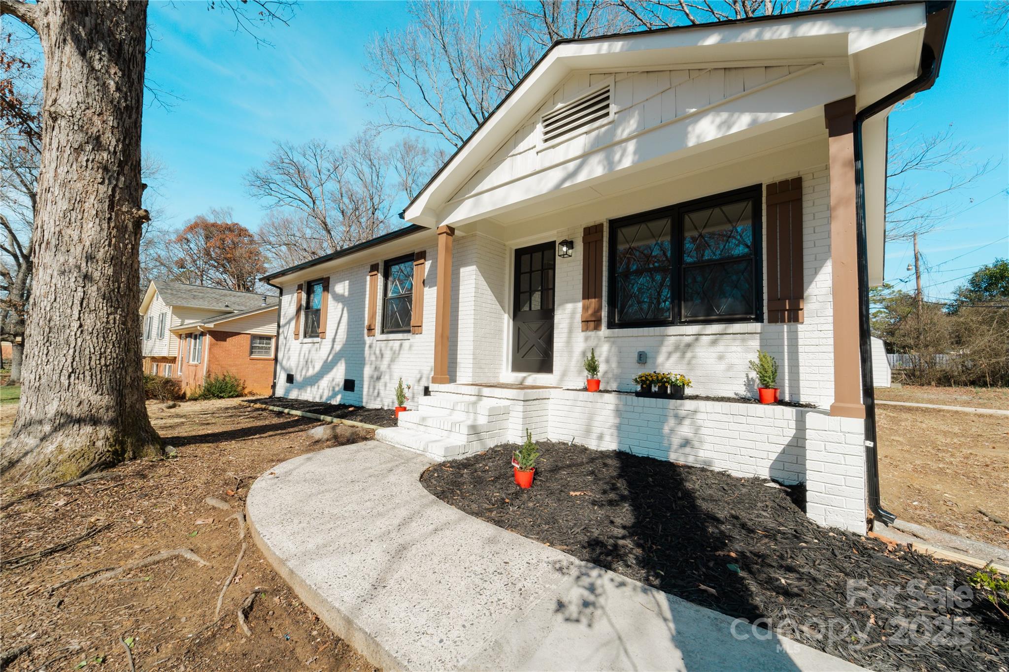 The property qualifies for our 100%, no PMI product with $20,000 in lender assistance. MOVE IN READY RANCH HOME!!!! This home is freshly painted inside and out with re-finished hardwood floors, updated kitchen and bathroom, NEW ROOF and NEW HVAC. Home also includes refrigerator, washer and dryer. Siting on a .26 acre lot less than 7miles from downtown Charlotte, Plaza Midwood and NODA!!!
