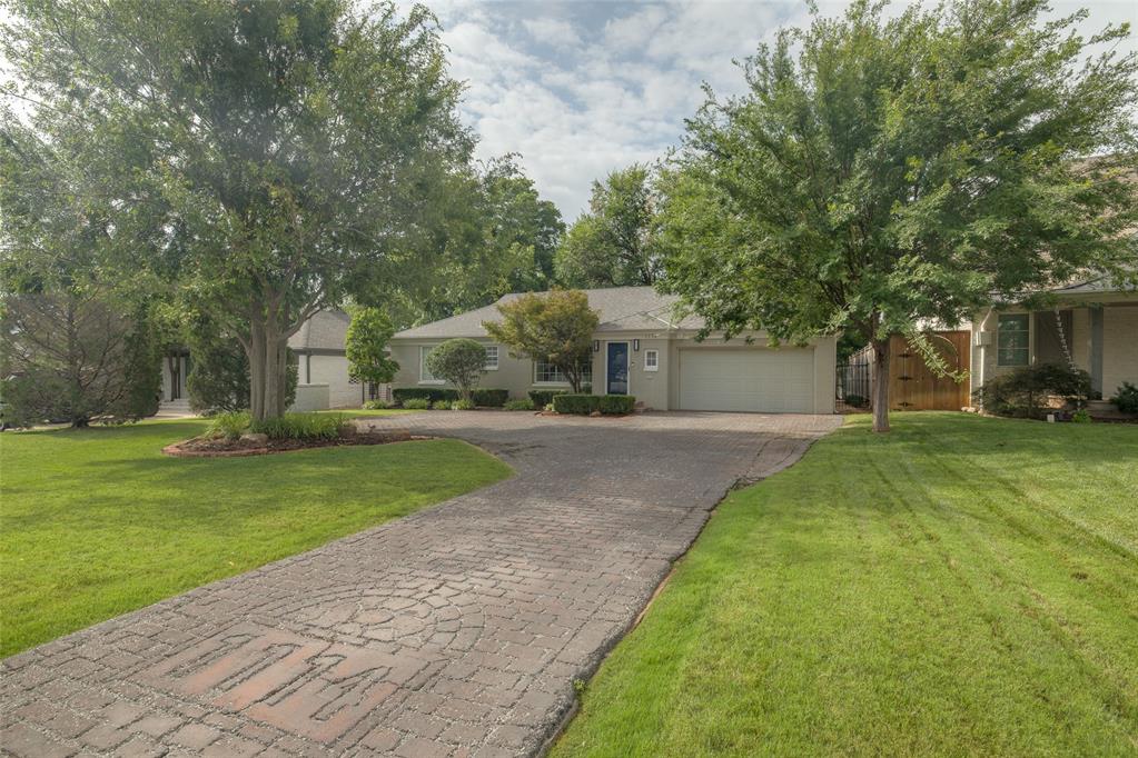 This beautifully renovated one-level home in Nichols Hills offers a combination of interior elegance, practicality, and exceptional outdoor space. Situated just blocks from Nichols Hills Plaza, Western Avenue, and Classen Curve, this property is ideally located to take advantage of Oklahoma City's best shopping, dining, and entertainment—all while offering quick access to major city thoroughfares.

Inside, the home features three spacious bedrooms, two bathrooms, and two distinct living areas that offer a perfect blend of functionality and comfort. The open kitchen, dining area, and sunroom create an inviting space ideal for daily living and frequent entertaining. A breakfast bar adds to the appeal, perfect for casual meals or conversation while cooking.

It is the expansive outdoor space that truly sets this home apart. Set on a generous lot with mature shade trees, the backyard provides a tranquil retreat. The lush grass, vibrant landscaping, and colorful plantings create a beautiful, well-maintained oasis, ideal for both relaxation and enjoyment. Over the backyard, an awning of old-growth trees embraces the space, creating a green-scape ceiling that takes generations to develop. The large yard offers endless possibilities—whether you envision adding a pool, garden, more living space or simply enjoying the outdoor living space as it is.

A tall privacy fence ensures complete seclusion, creating a peaceful and private environment where you can unwind and enjoy the natural surroundings without distraction. The ample space and serene atmosphere make this backyard a true highlight of the property.

With its combination of sleek, calm interiors and serene yard, this home offers the perfect balance of indoor-outdoor living. It is turn-key, stress free, and quite simply, ready to be enjoyed!