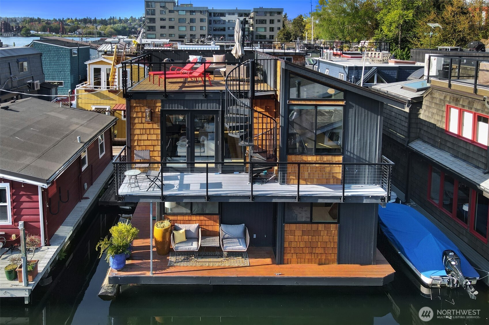 Chase your dreams and own a floating home in Seattle's famous waterfront community. This meticulously maintained 1970's home was just renovated in 2021. Never again will you compromise on space, light, and enjoyment. Two generously sized bedrooms located on the channel side and the third bedroom used as an office on the upper level. You'll love the over sized utility room so multifaceted, it can also be used as a dog washing station, exercise room, storage for your outdoor gear and more! Take your pick of three south facing decks for your viewing pleasure. The DOX community is comprised of 32 homes on a cooperative owned dock in the very popular Eastlake community. So completely move in ready all you have to do is enjoy fun in the sun.